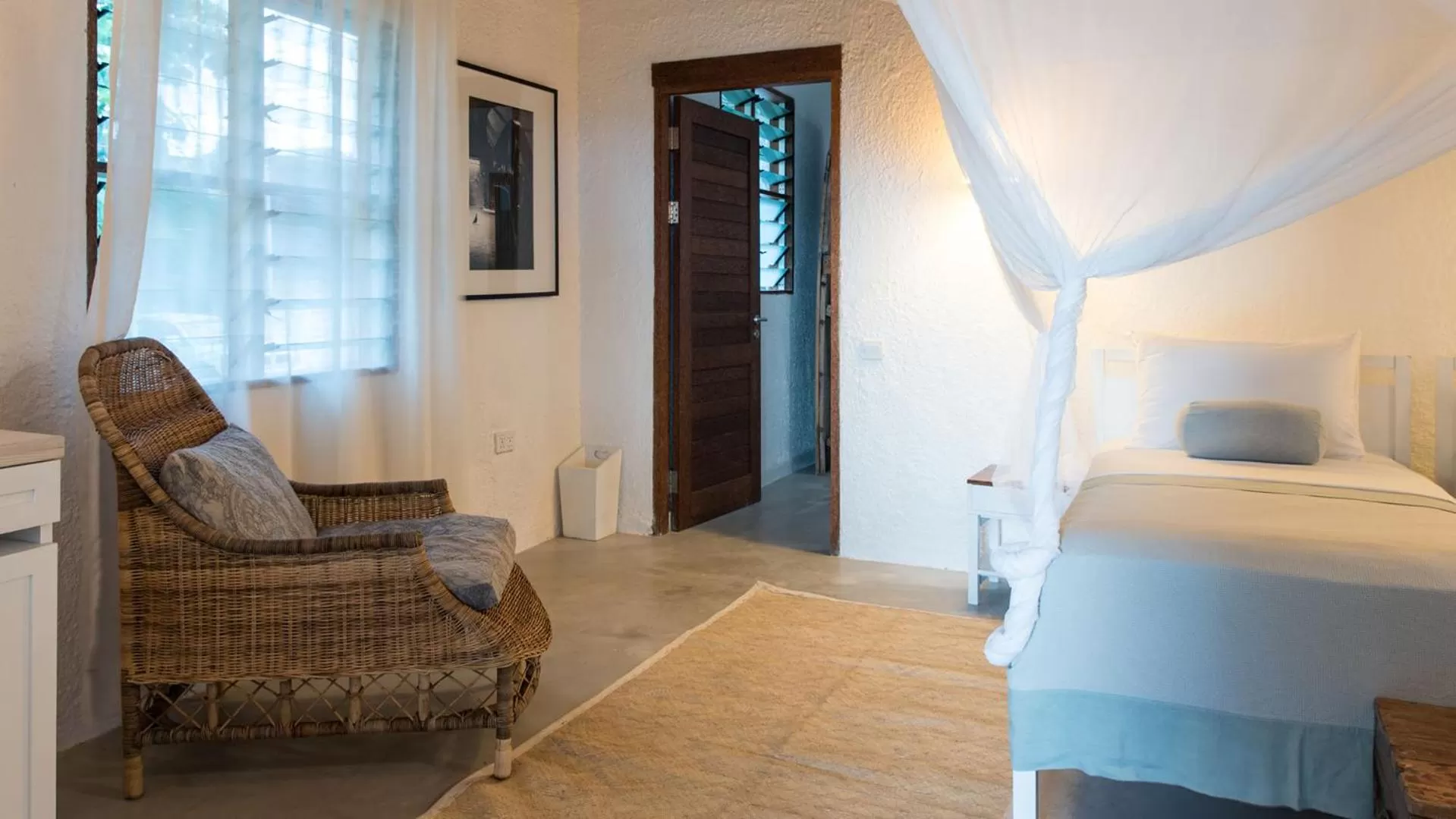 Seating area, Bed in Chuini Zanzibar Lodge by NEWMARK