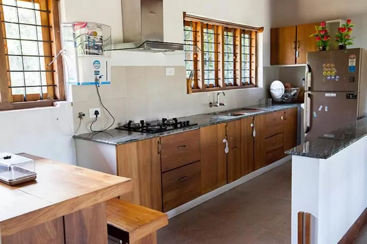 Kitchen or kitchenette, Kitchen/Kitchenette in Marmalade Springs Resort Wayanad