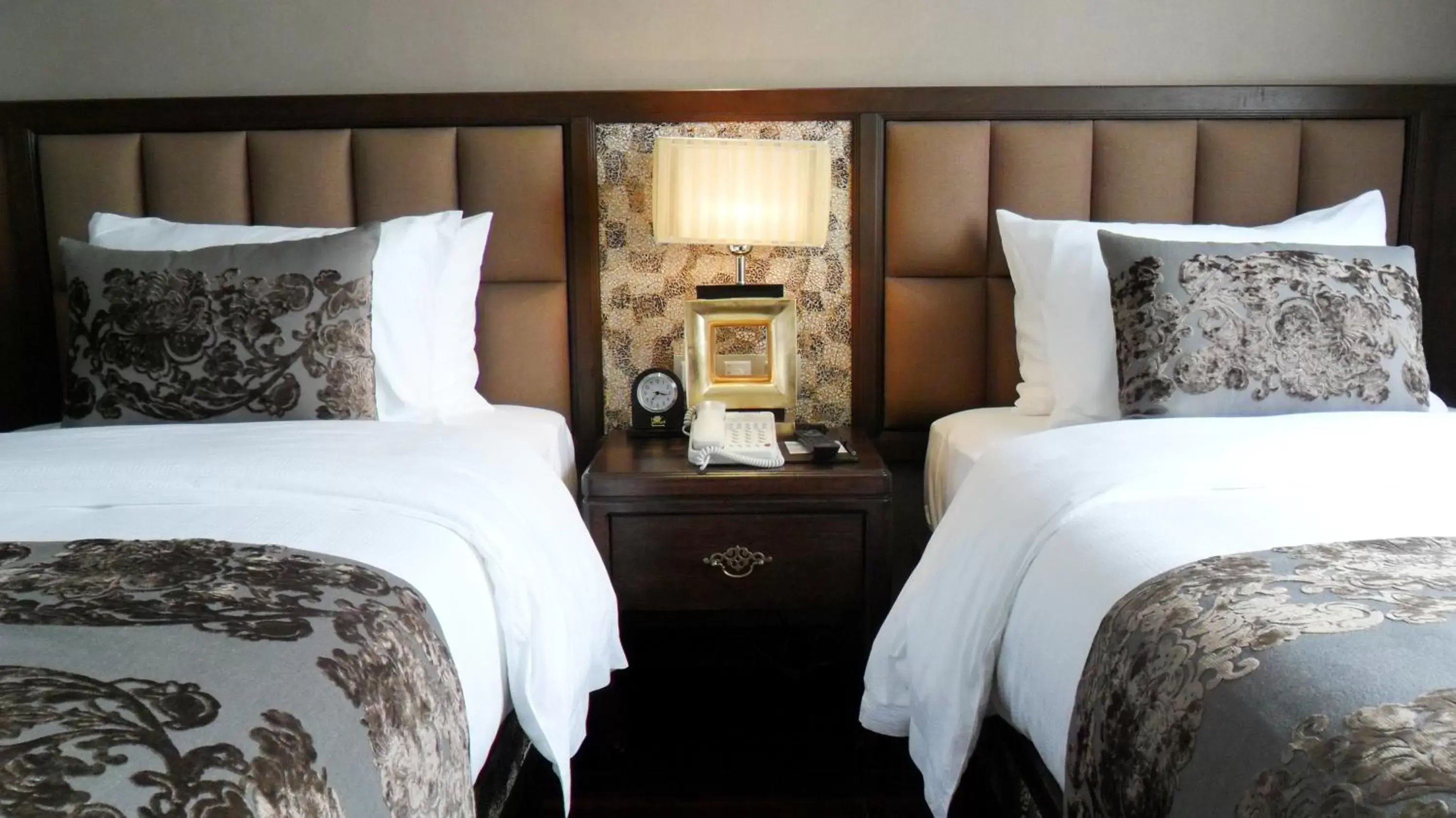 Bed in Golden Lotus Luxury Hotel