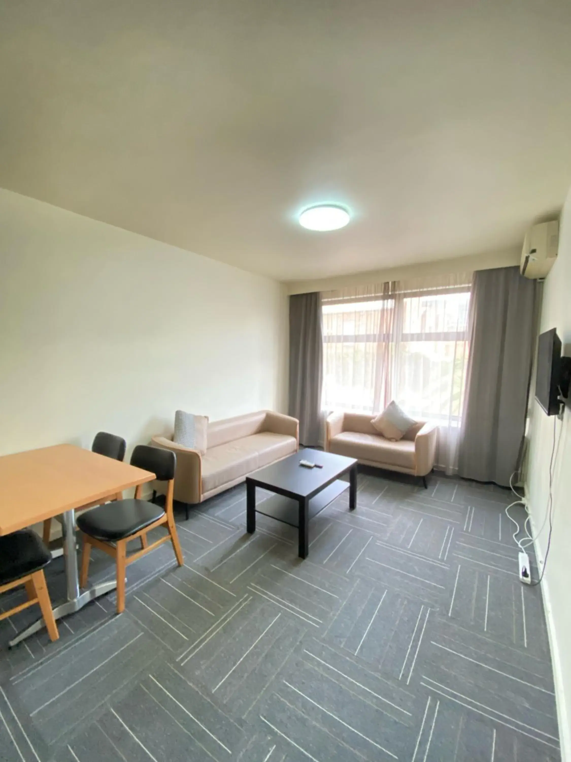 Seating Area in City Edge East Melbourne Apartment Hotel