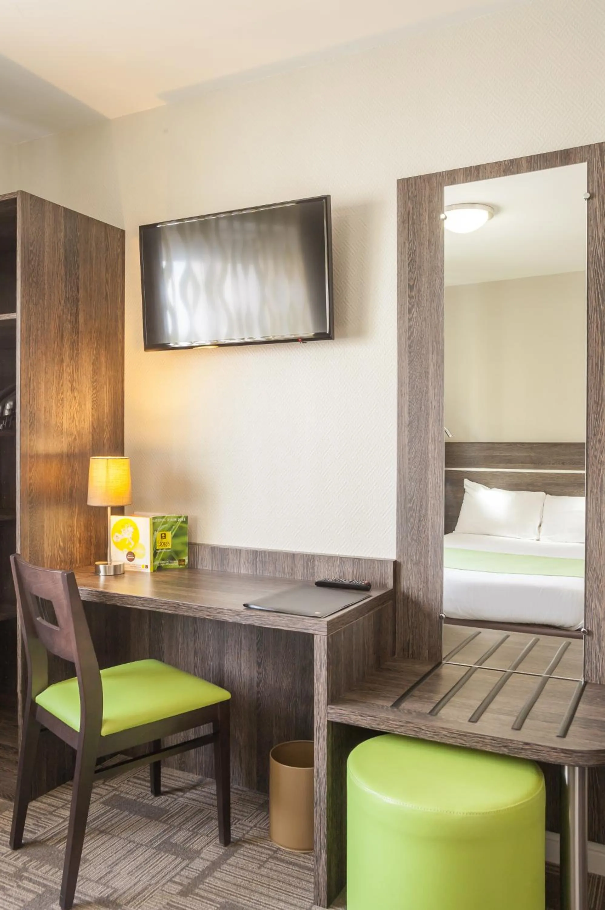 Seating area, Bed in Logis Hôtel Les Voyageurs