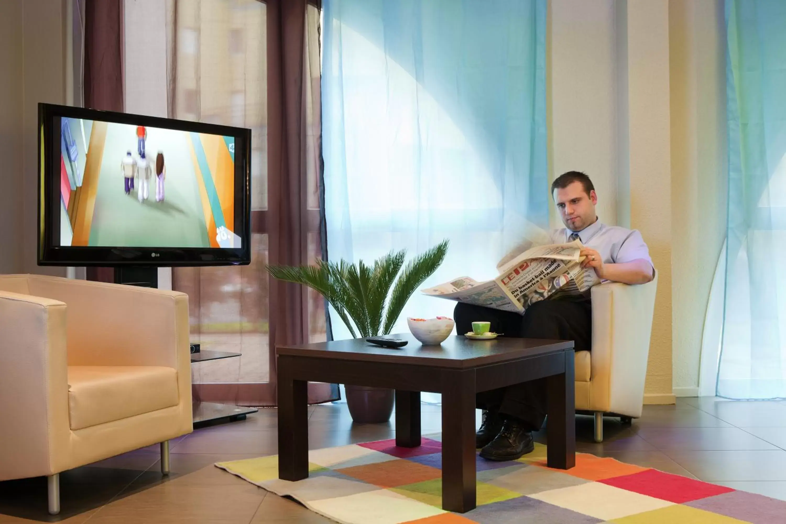 Lounge or bar, TV/Entertainment Center in ibis Styles Belfort Centre