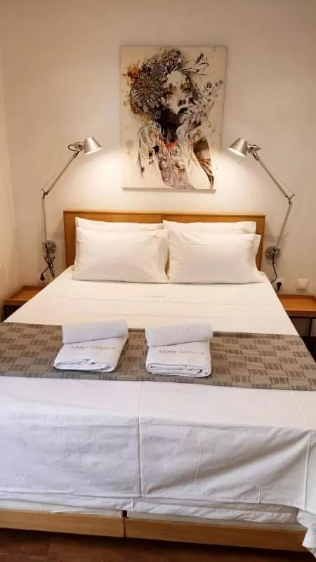 Bed in Saint George Boutique Rooms
