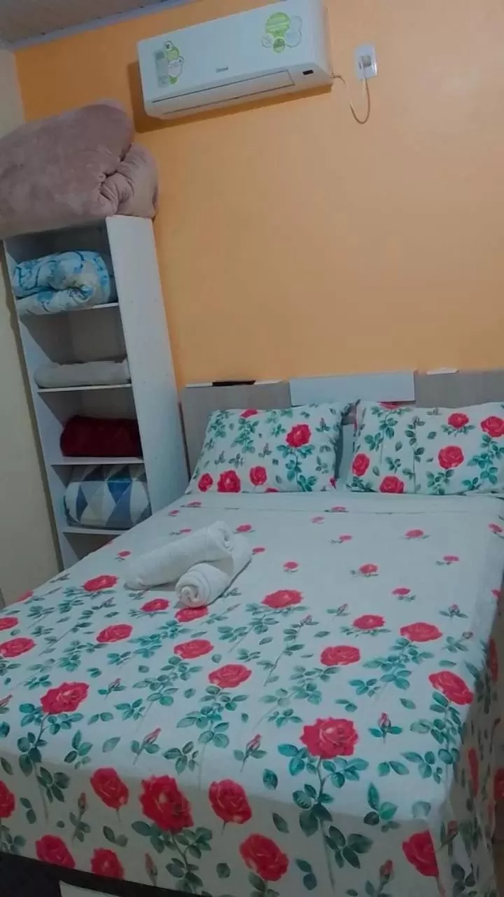 Bed in Pousada Família Cordeiro