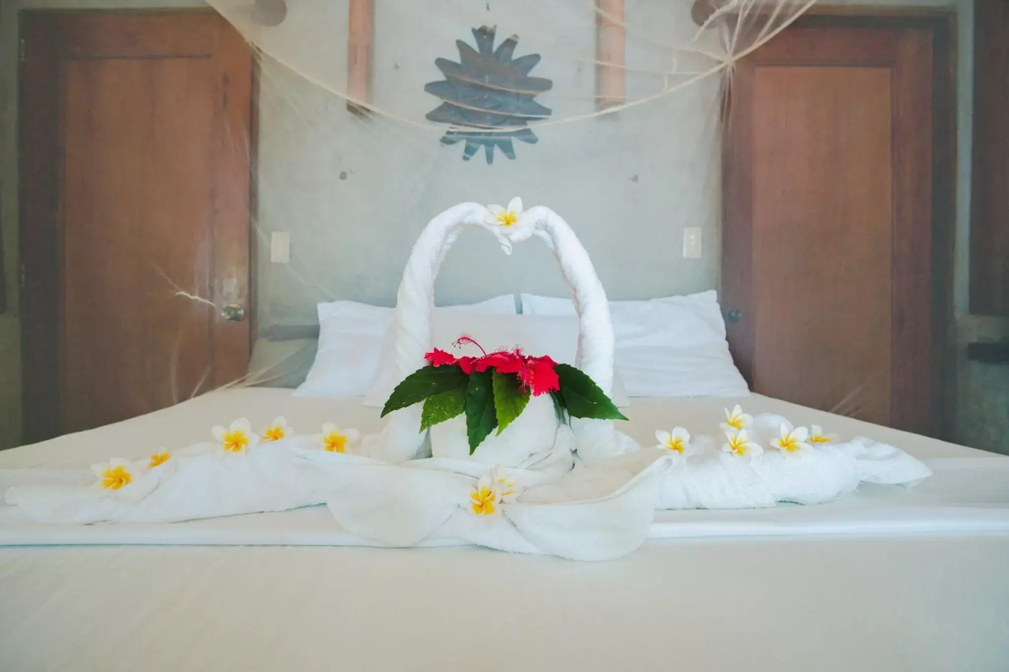 Bed in Sangat Island Dive Resort