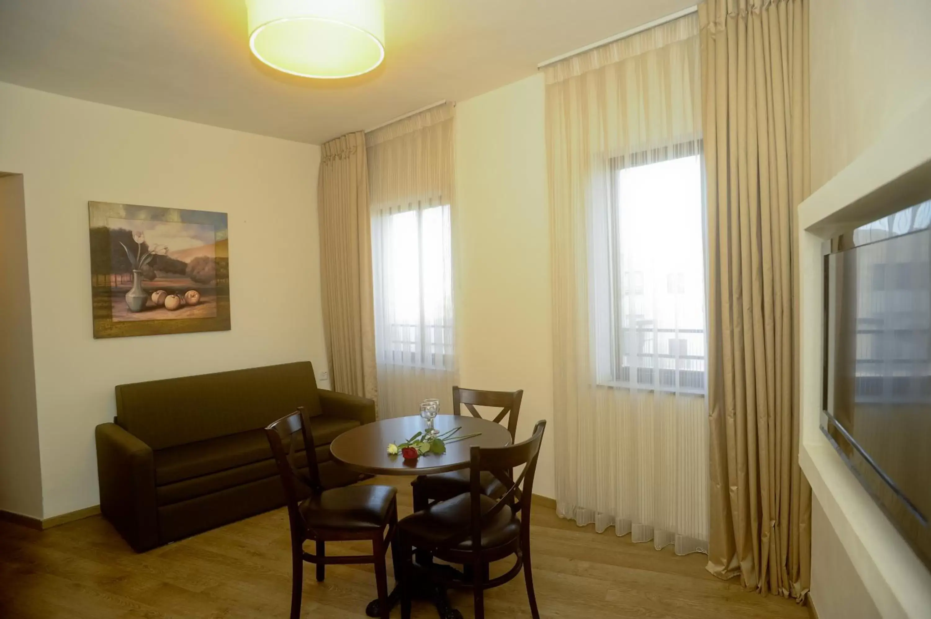 Living room, Dining Area in Lev Yerushalayim Hotel