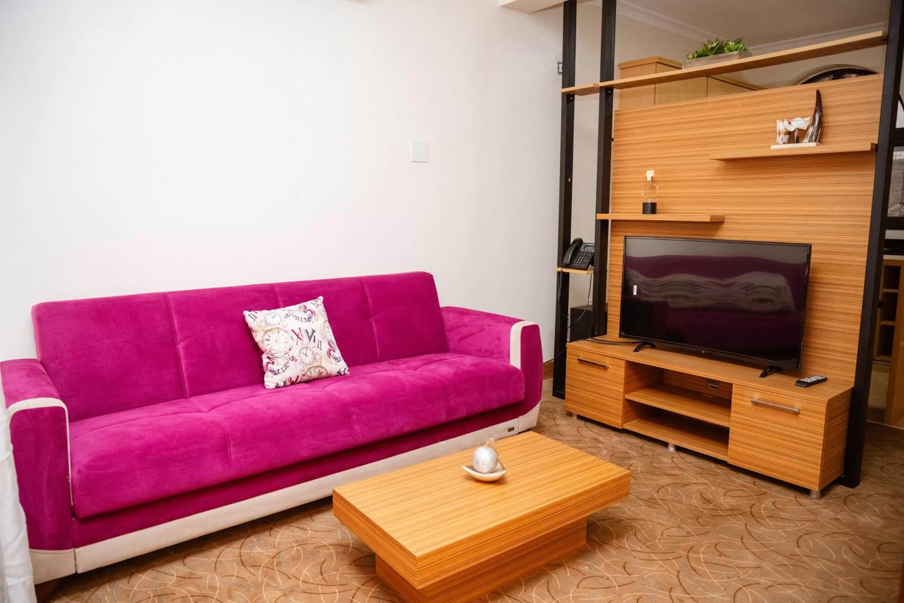 Communal lounge/ TV room in Ndaru Luxury Suites