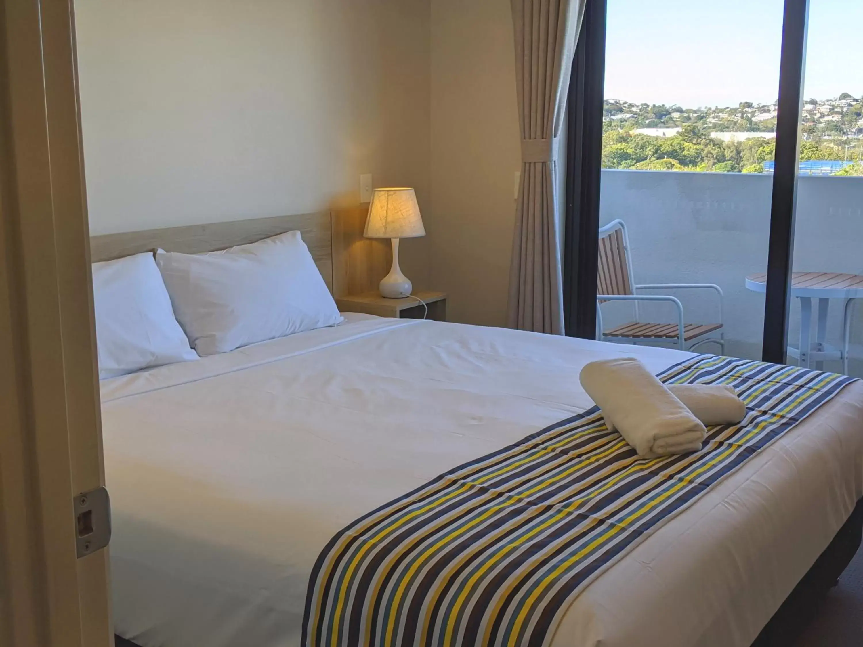 Bed in The Windsor Apartments and Hotel Rooms, Brisbane