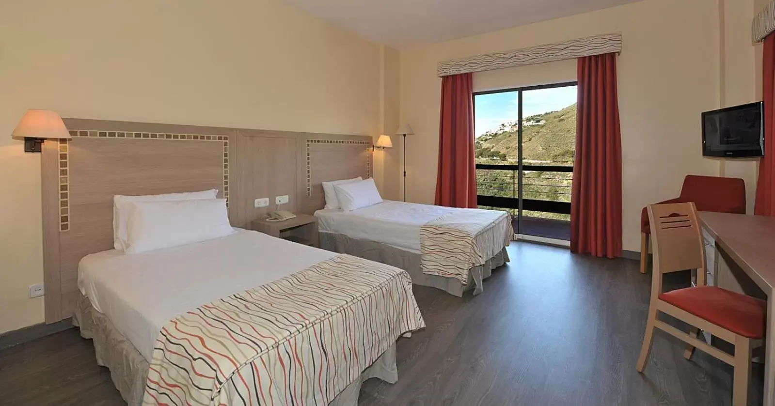 Bed in Hotel Salobreña Suites