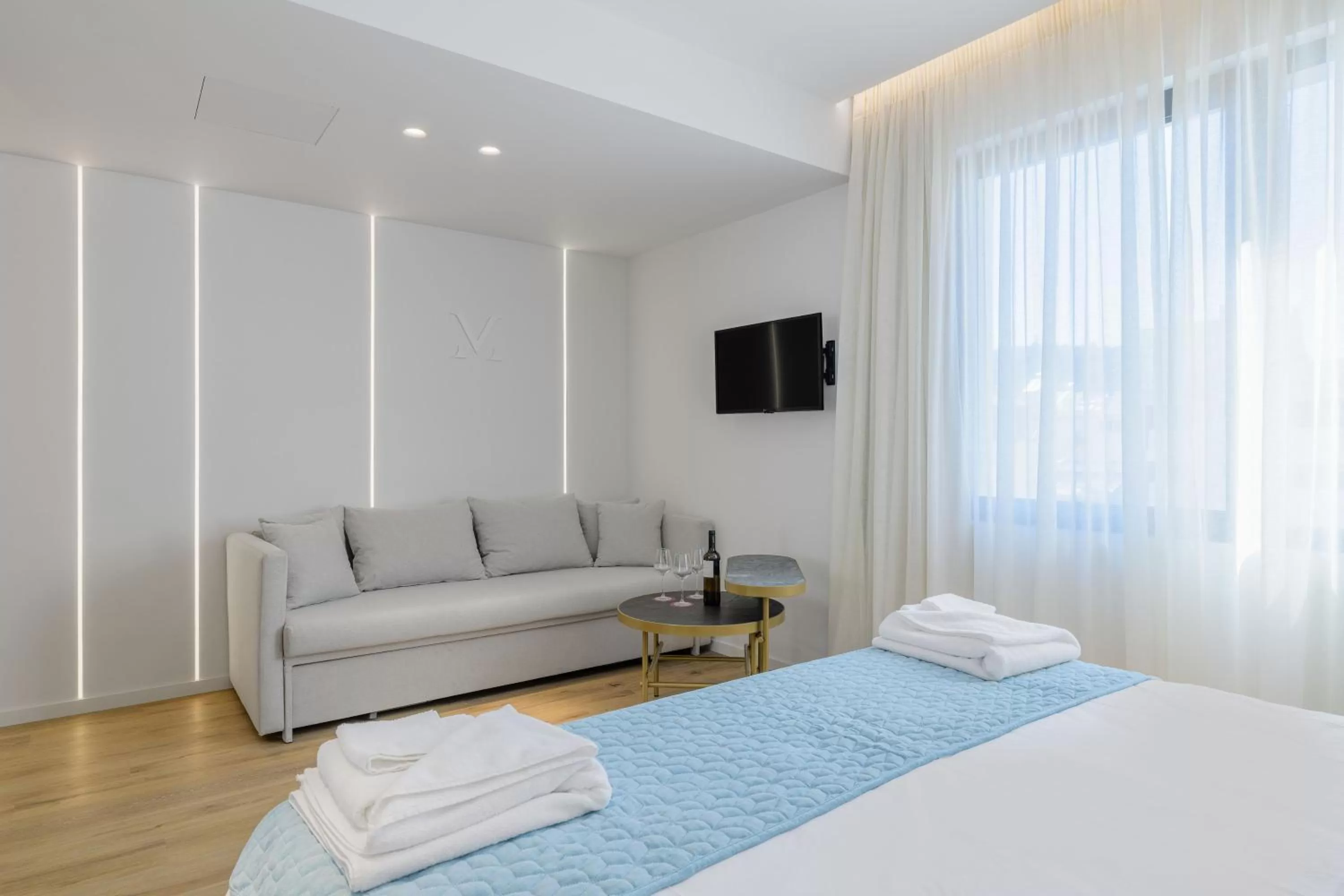 Bed in Acropolis Magenta Luxury Suites