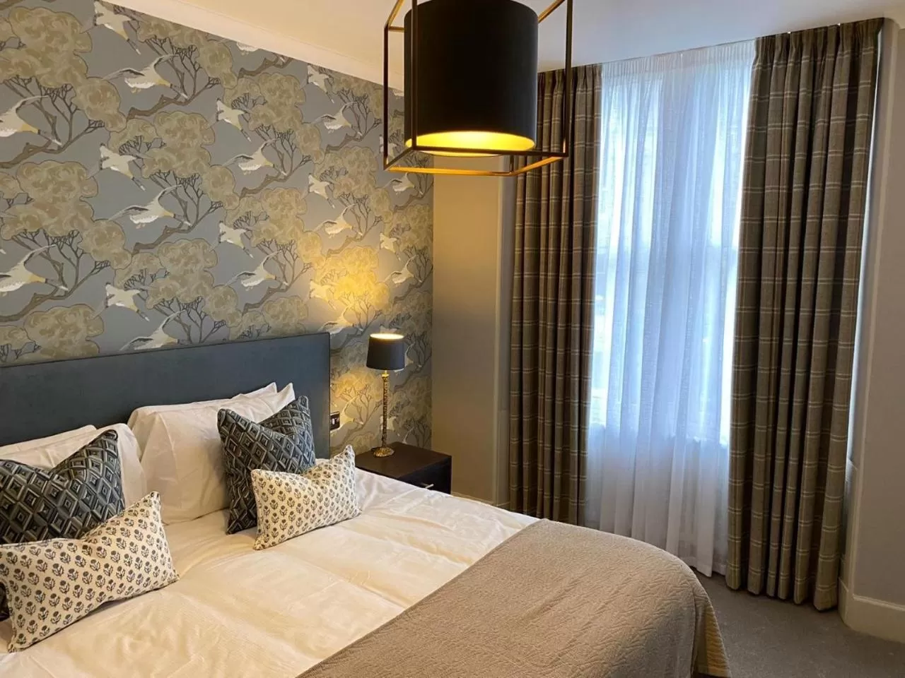 Bed in Rooms at the Saint