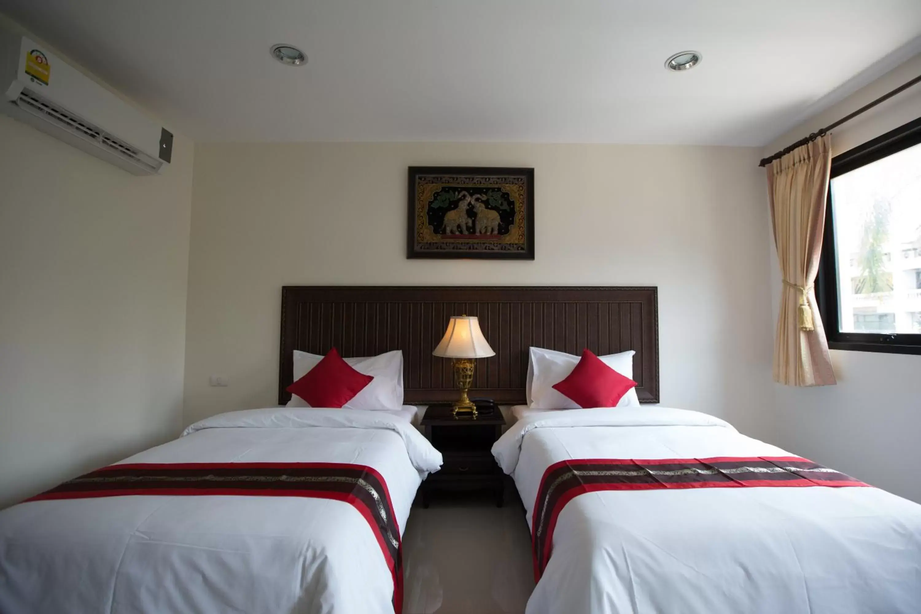 Bed in True Siam Rangnam Hotel