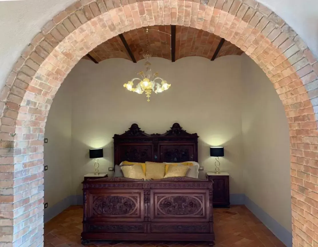 Bed in Cordella In Valdorcia Truffle and Olive Oil Resort