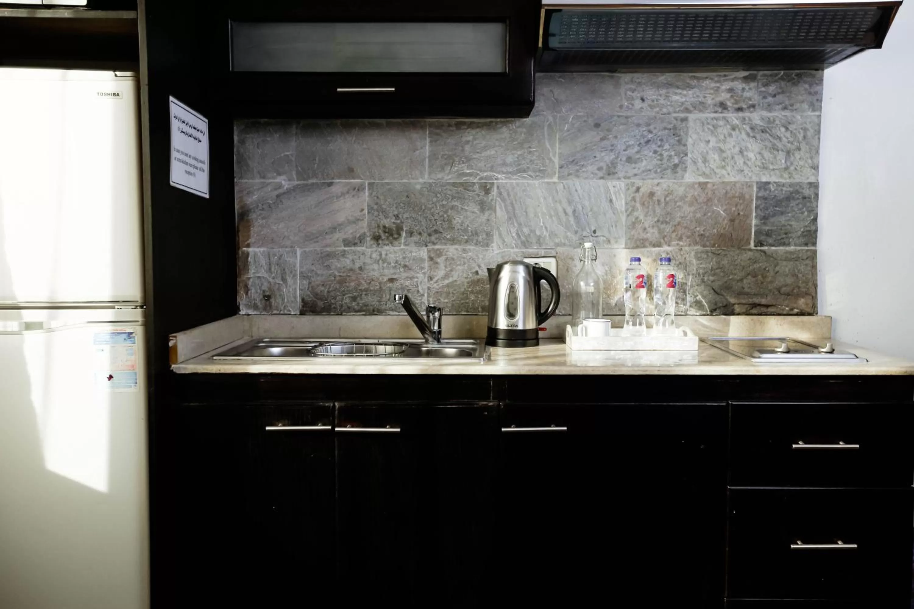 Kitchen or kitchenette in NewCity Hotel & Suites