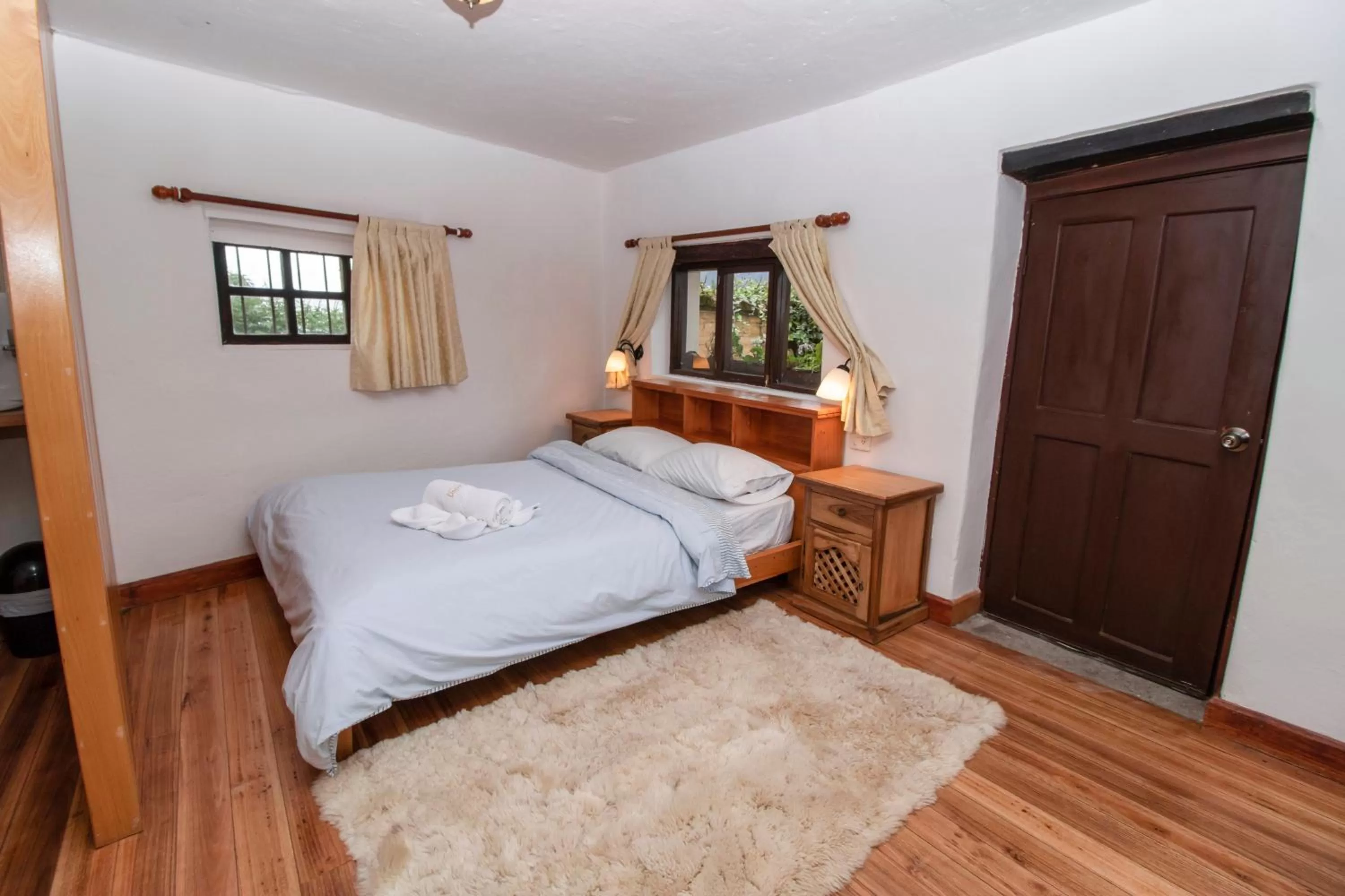 Bed in Hosteria Papagayo Cotopaxi