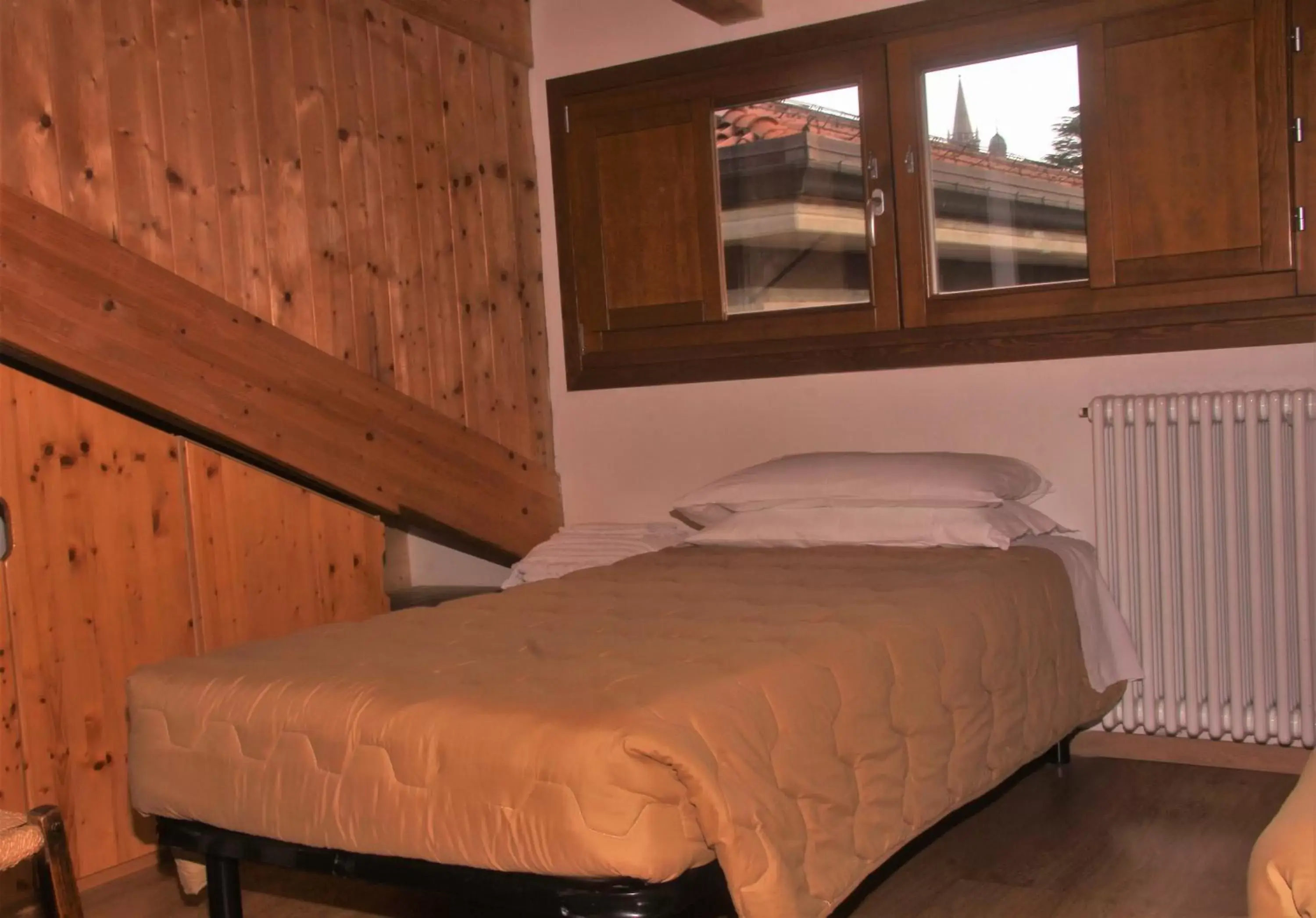 Bed in Piccolo Hotel