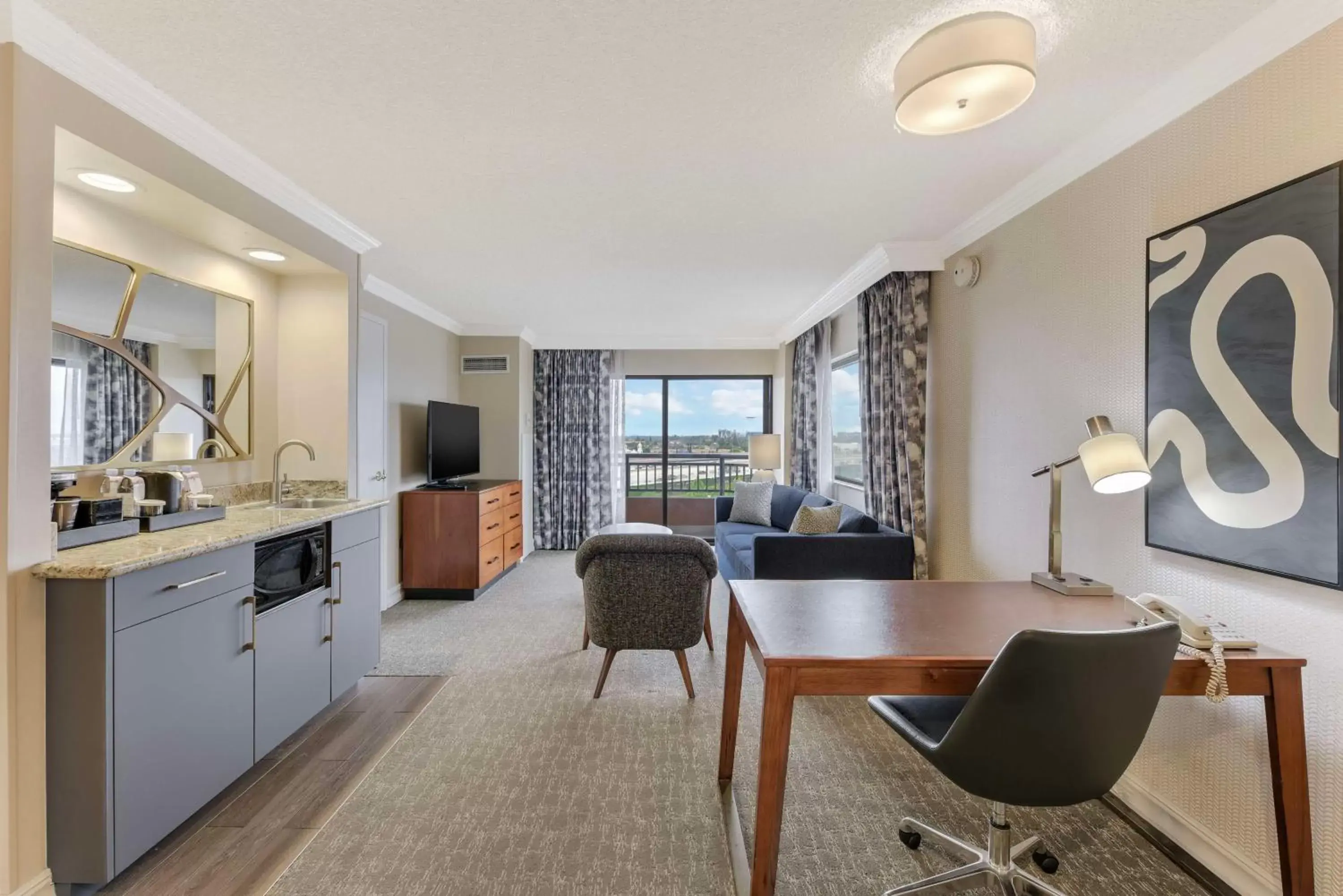 Living room, Kitchen/Kitchenette in Embassy Suites by Hilton Anaheim-Orange