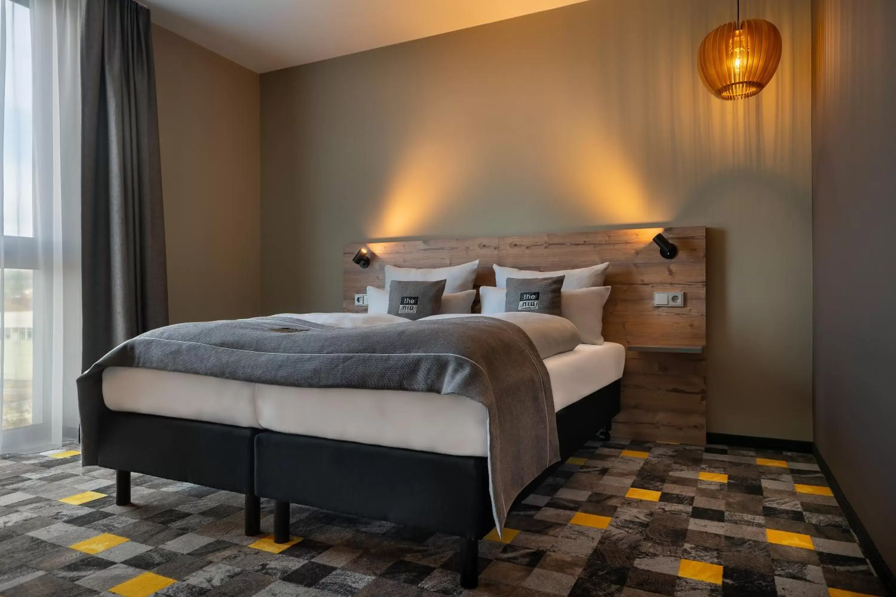 Bedroom, Bed in Holiday Inn - the niu, Timber Esslingen by IHG Bedroom, Bed in Holiday Inn - the niu, Timber Esslingen by IHG