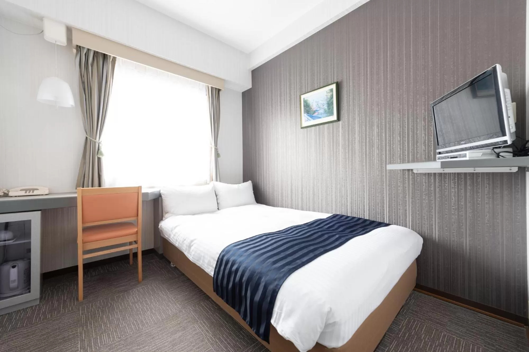 Bed in Tottori City Hotel