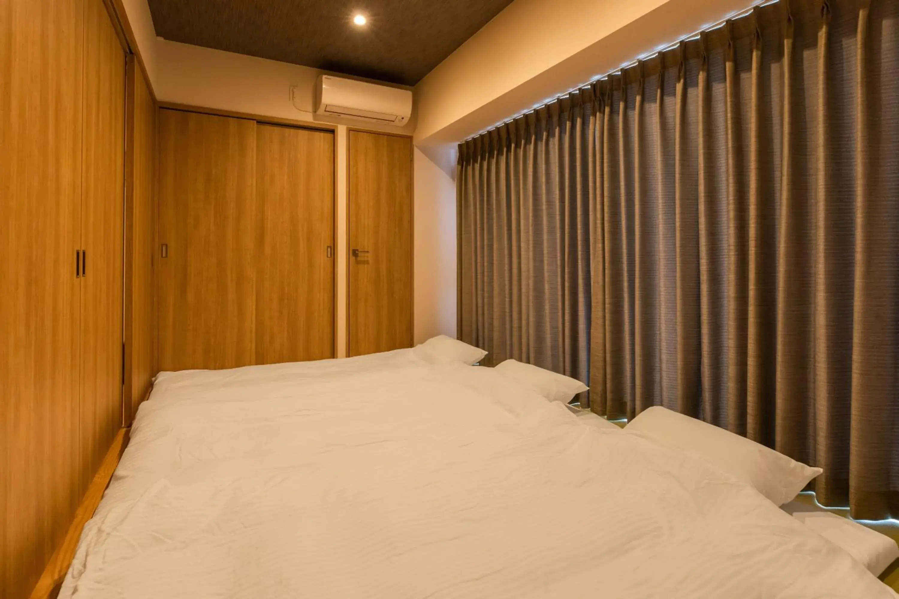 Bed in LAPIN MIHAMA Residence Hotel