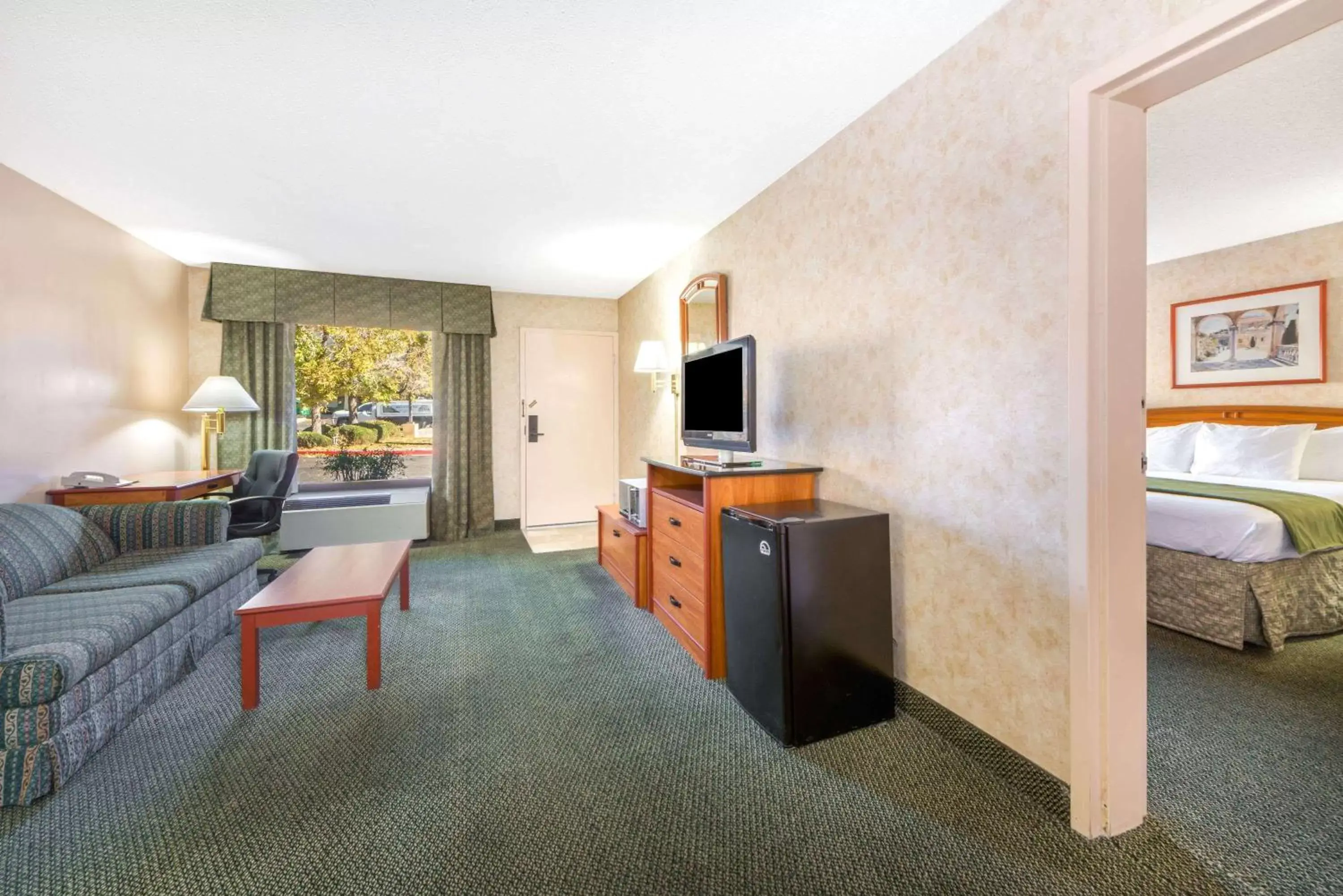 Photo of the whole room, Seating Area in Days Inn & Suites by Wyndham Albuquerque North