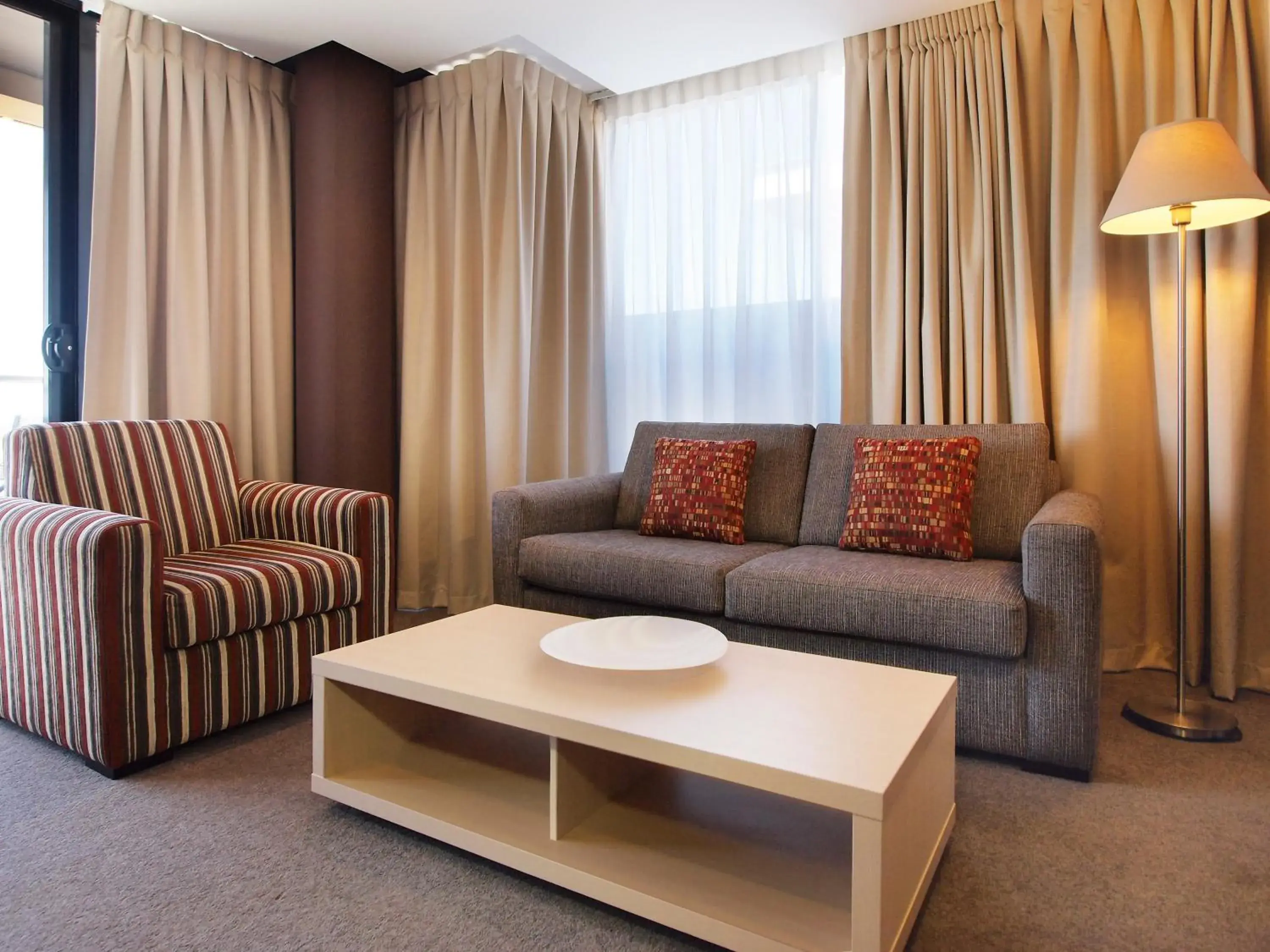 Living room in Oaks Adelaide Horizons Suites Living room in Oaks Adelaide Horizons Suites