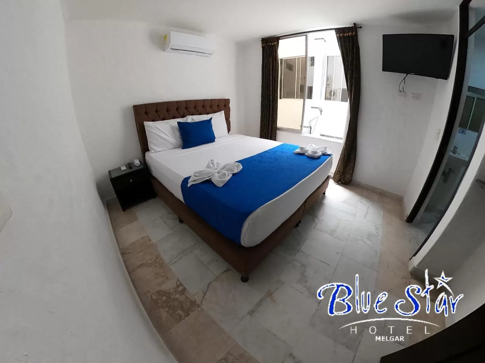 Bed in Blue Star Hotel