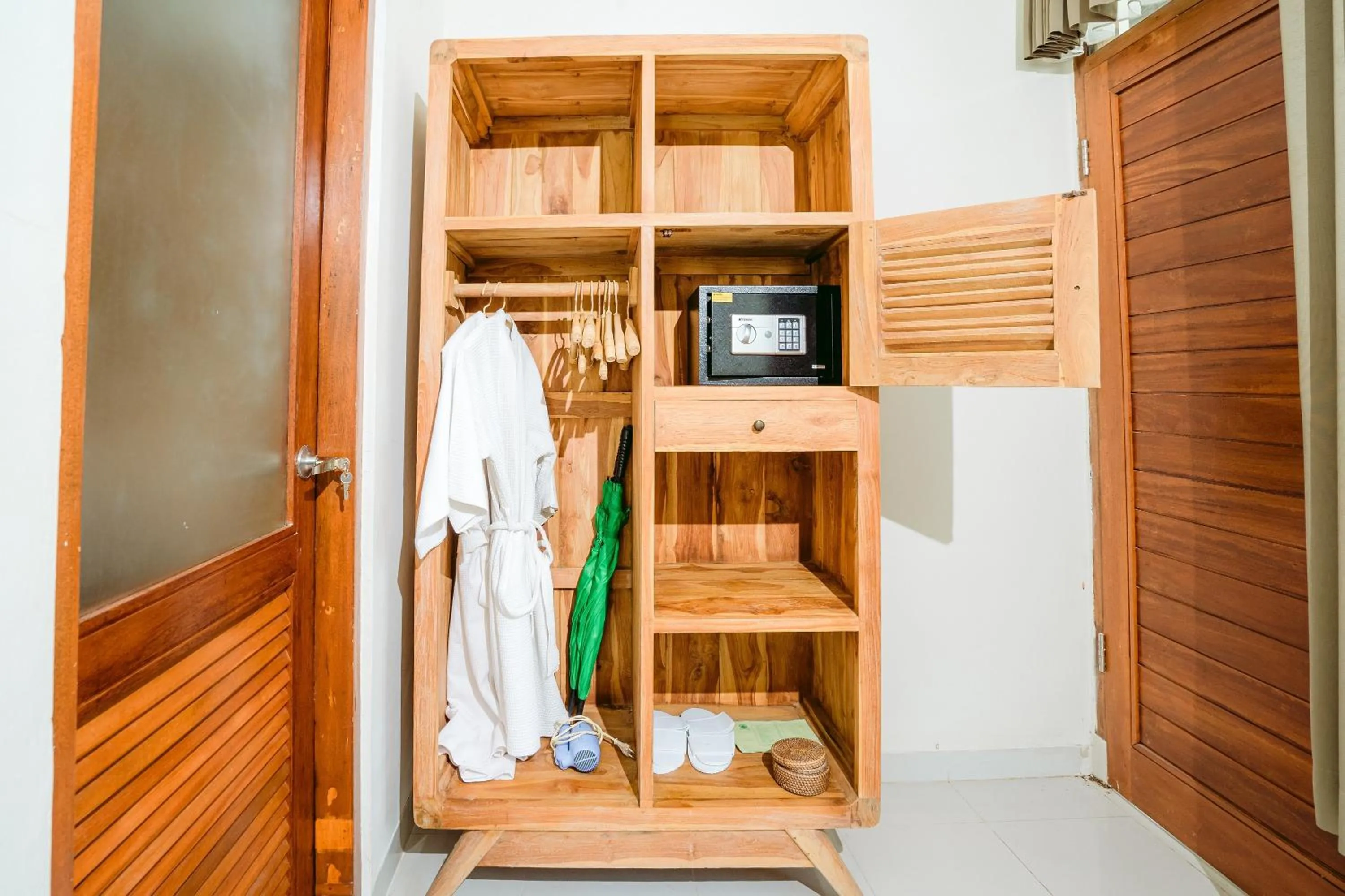 wardrobe in Pertiwi Resort & Spa