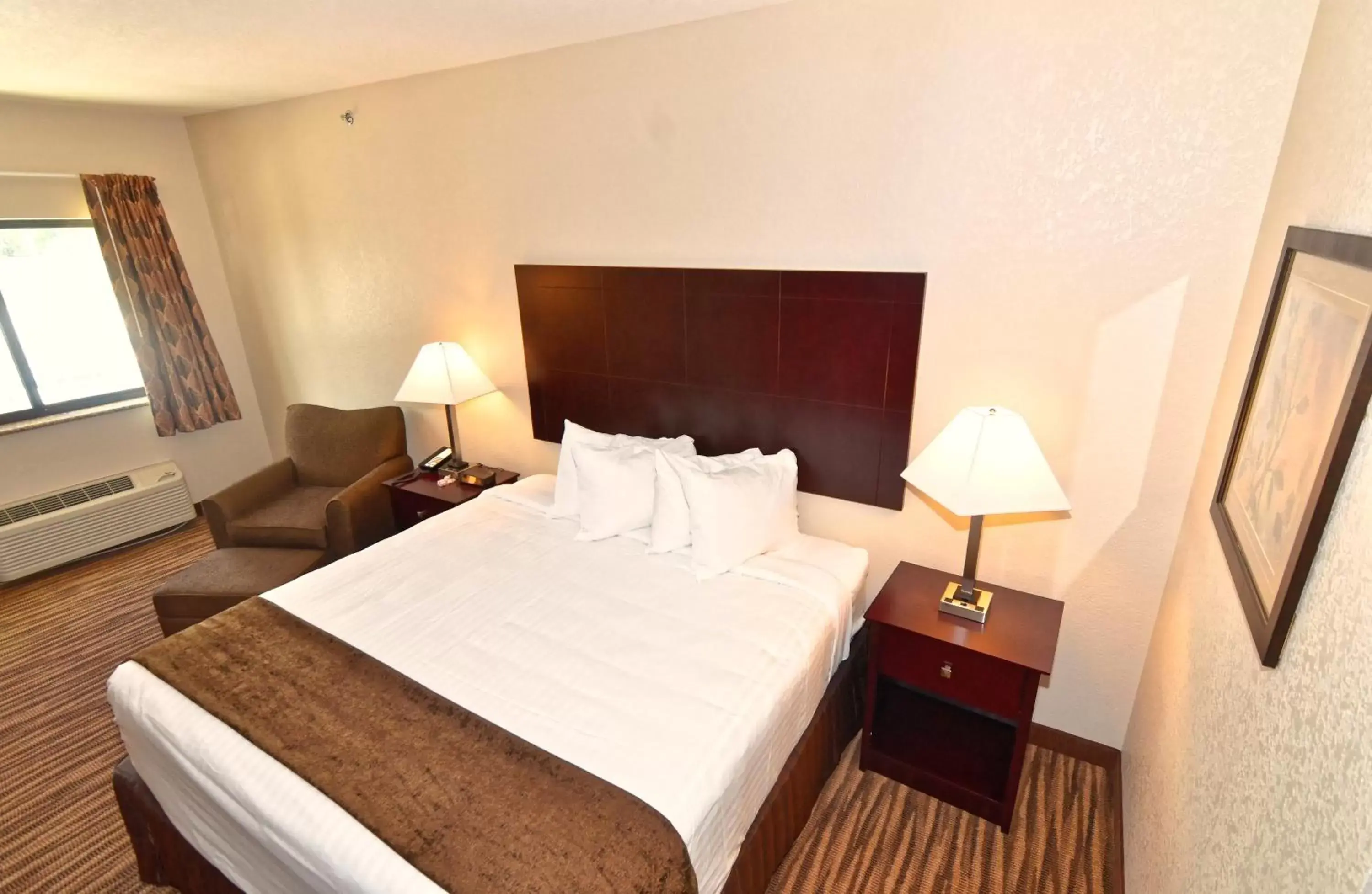 Bed in Cobblestone Inn & Suites - Clarion