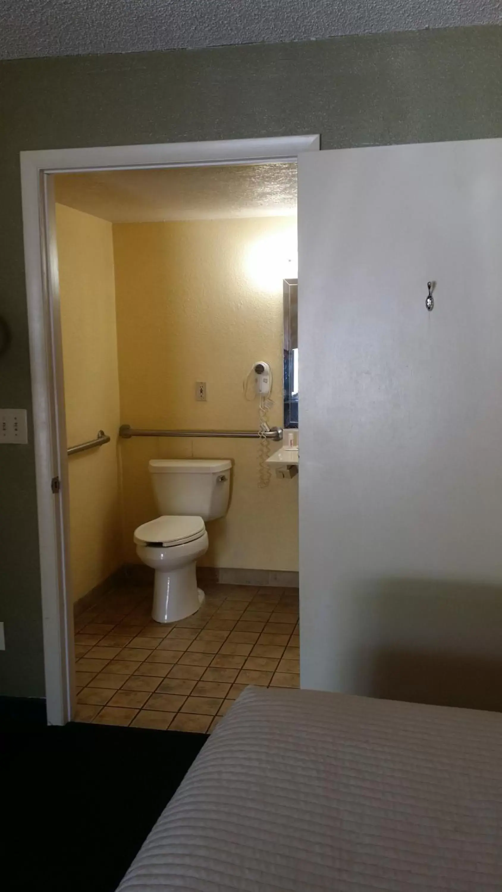 Bathroom in Days Inn by Wyndham Cocoa Cruiseport West At I-95/524
