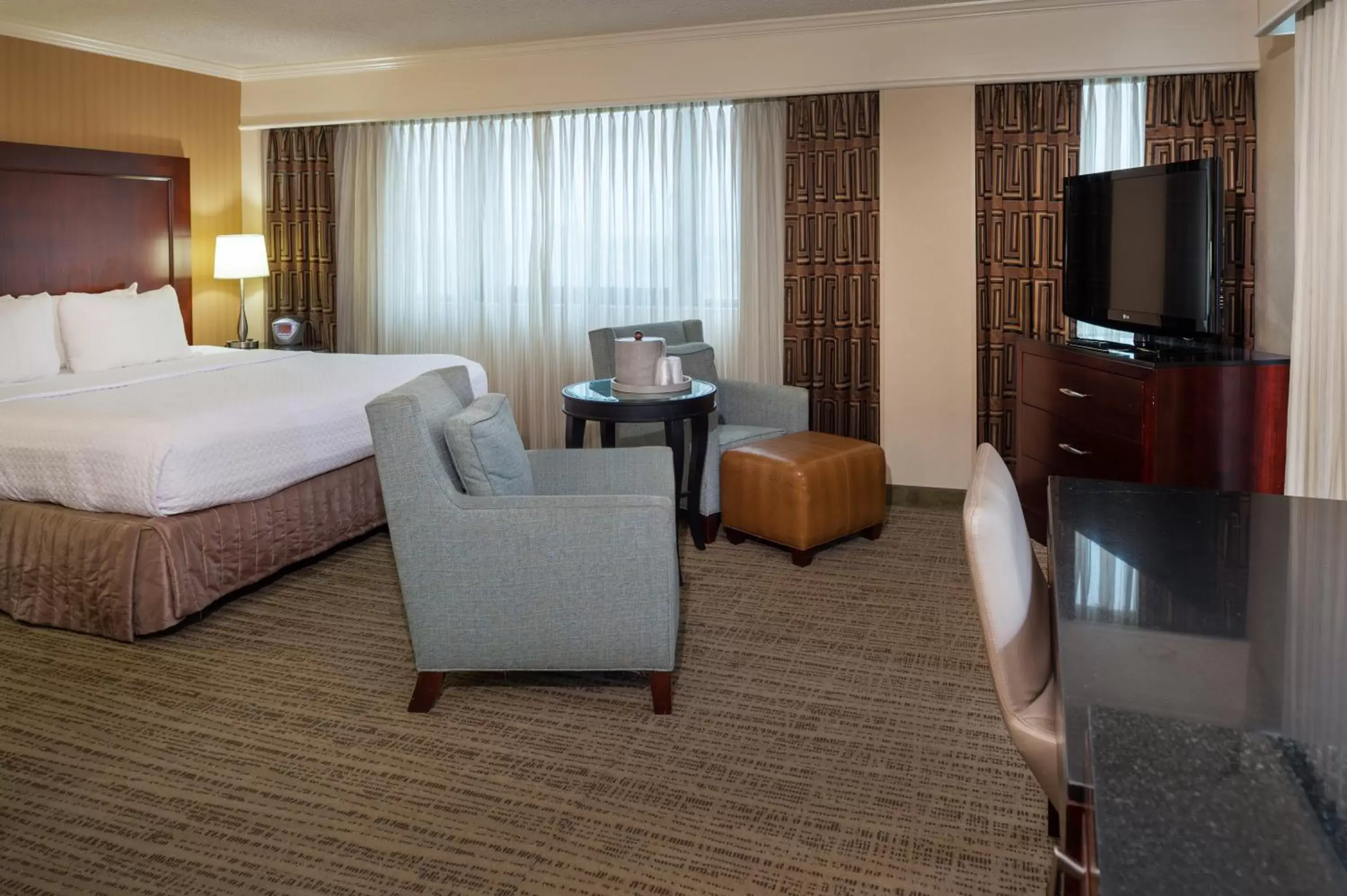 Photo of the whole room, TV/Entertainment Center in Crowne Plaza Hotel St. Louis Airport, an IHG Hotel