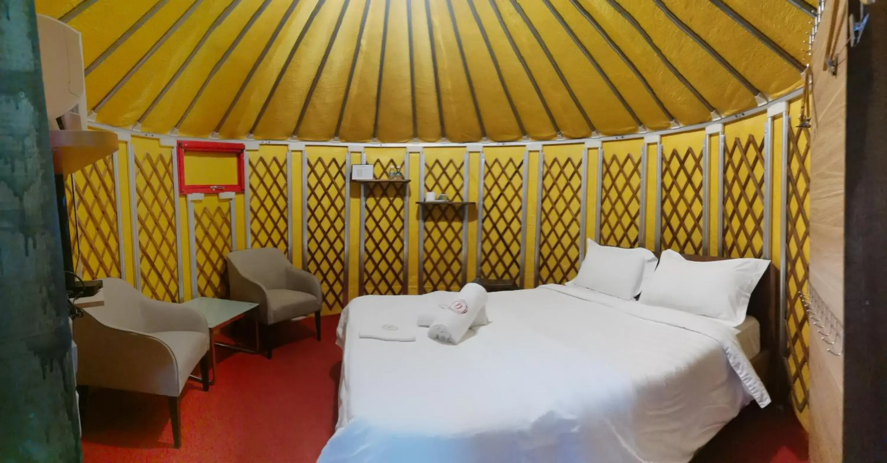 Communal lounge/ TV room, Bed in Rick Resort Teluk Intan