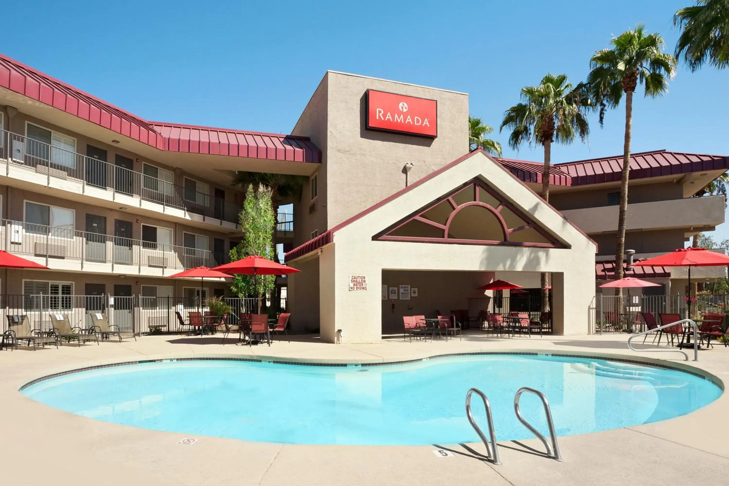 Swimming pool, Property Building in Ramada by Wyndham Tempe/At Arizona Mills Mall