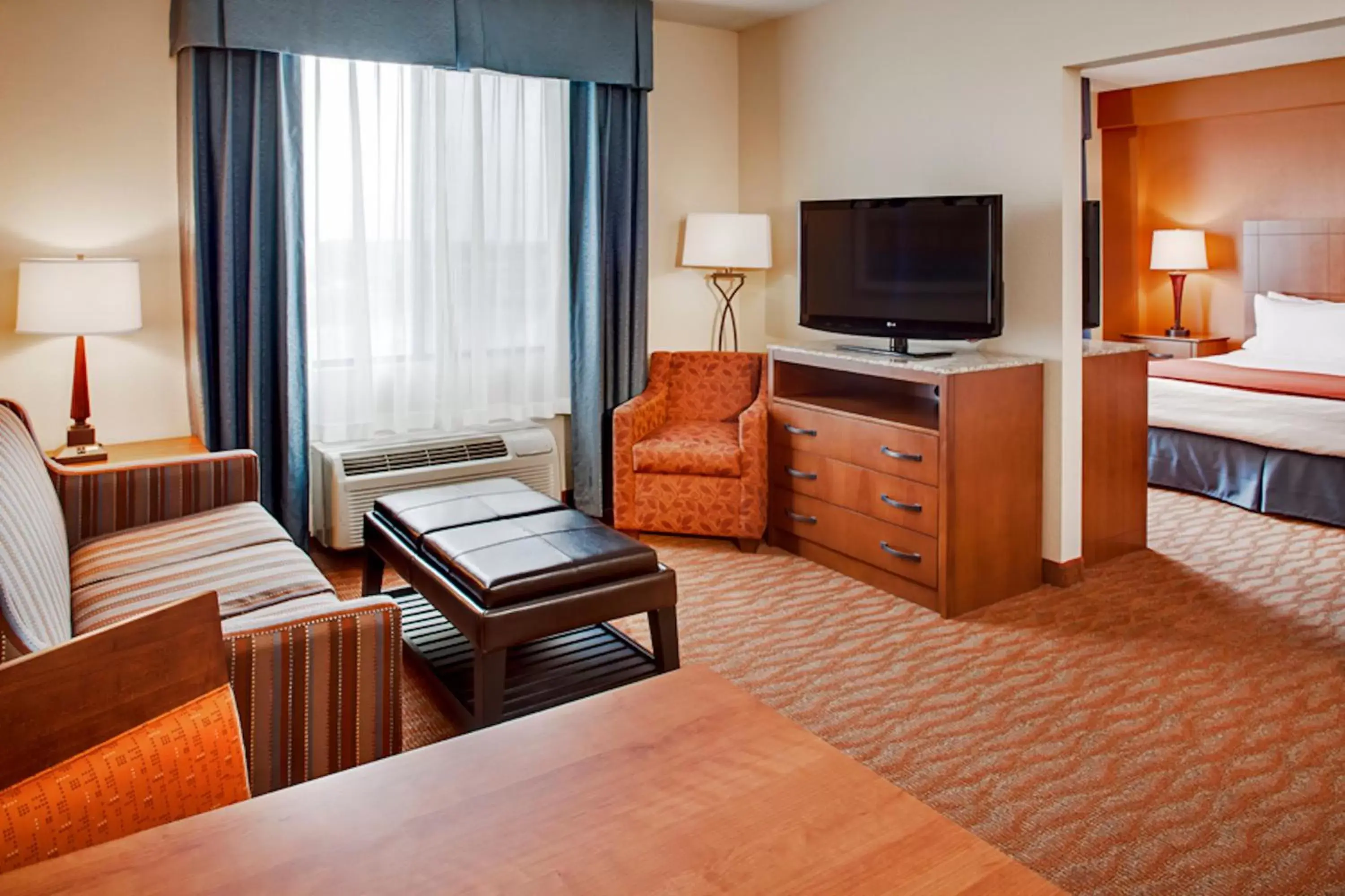 Photo of the whole room, TV/Entertainment Center in Holiday Inn Express Hotel & Suites Coralville, an IHG Hotel