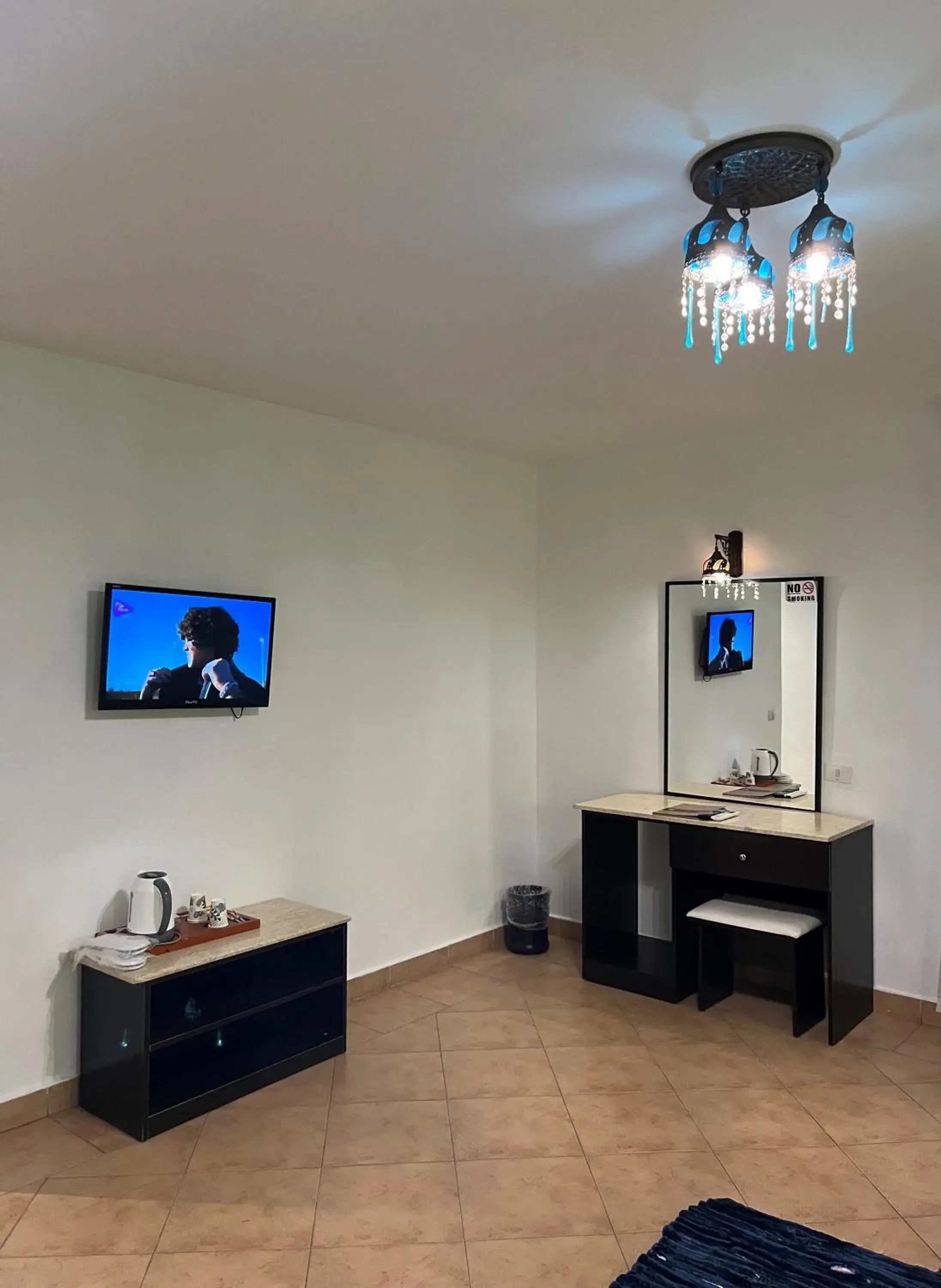 Bedroom, TV/Entertainment Center in Naama Blue Hotel