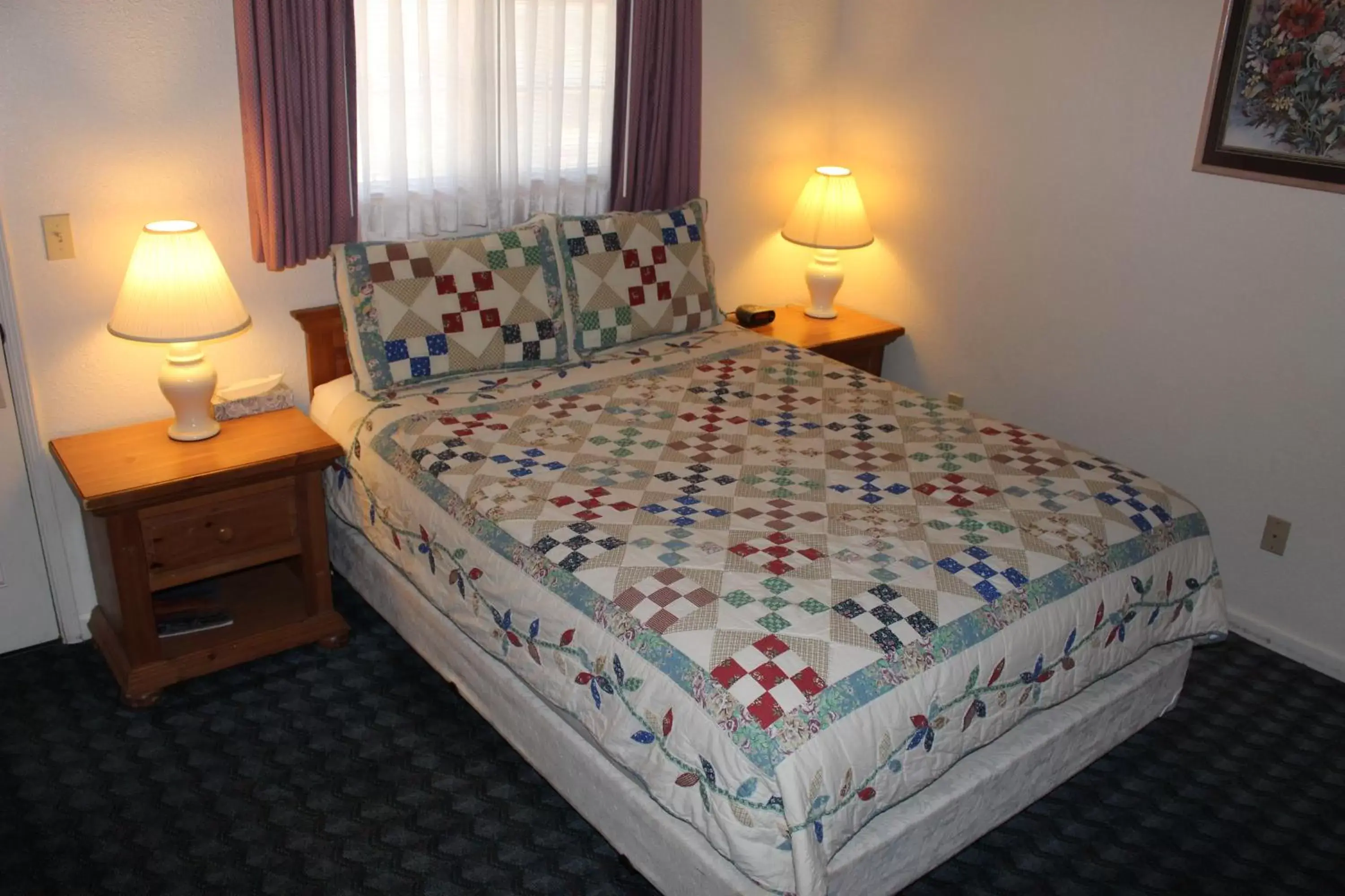 Bed in Barewood Inn & Suites