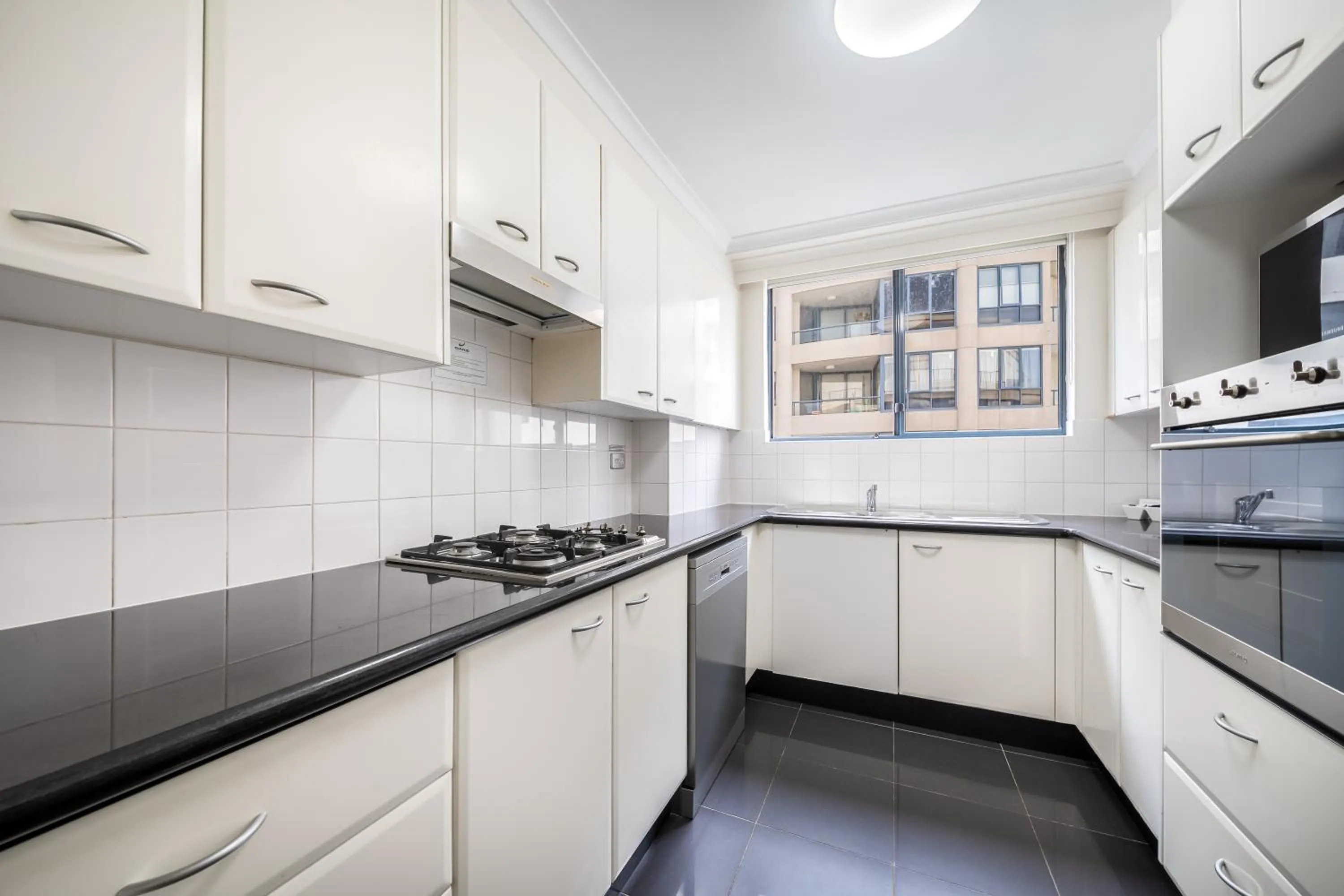Kitchen or kitchenette in Oaks Sydney Castlereagh Suites