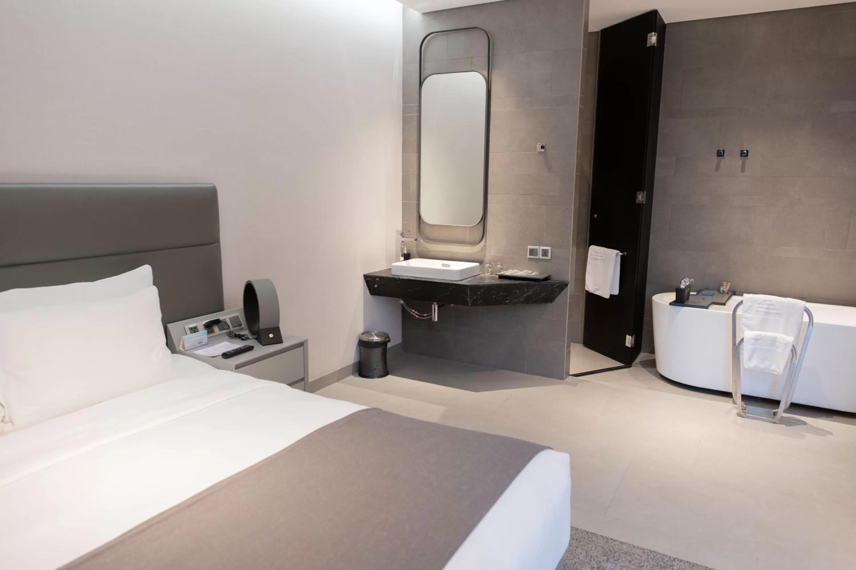 Bath, Bed in M Hotel Saigon