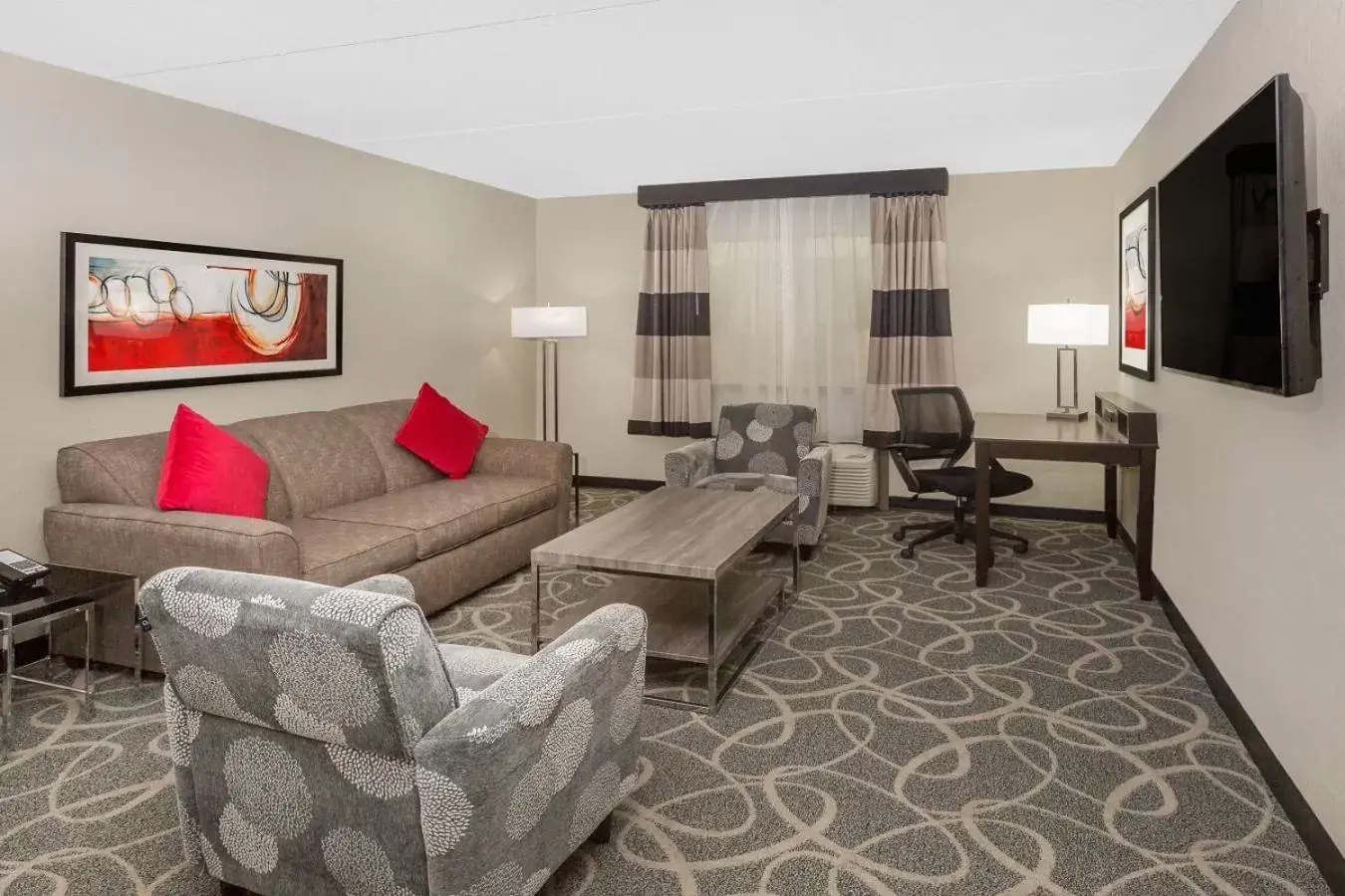 Seating Area in Ramada by Wyndham Des Moines Airport