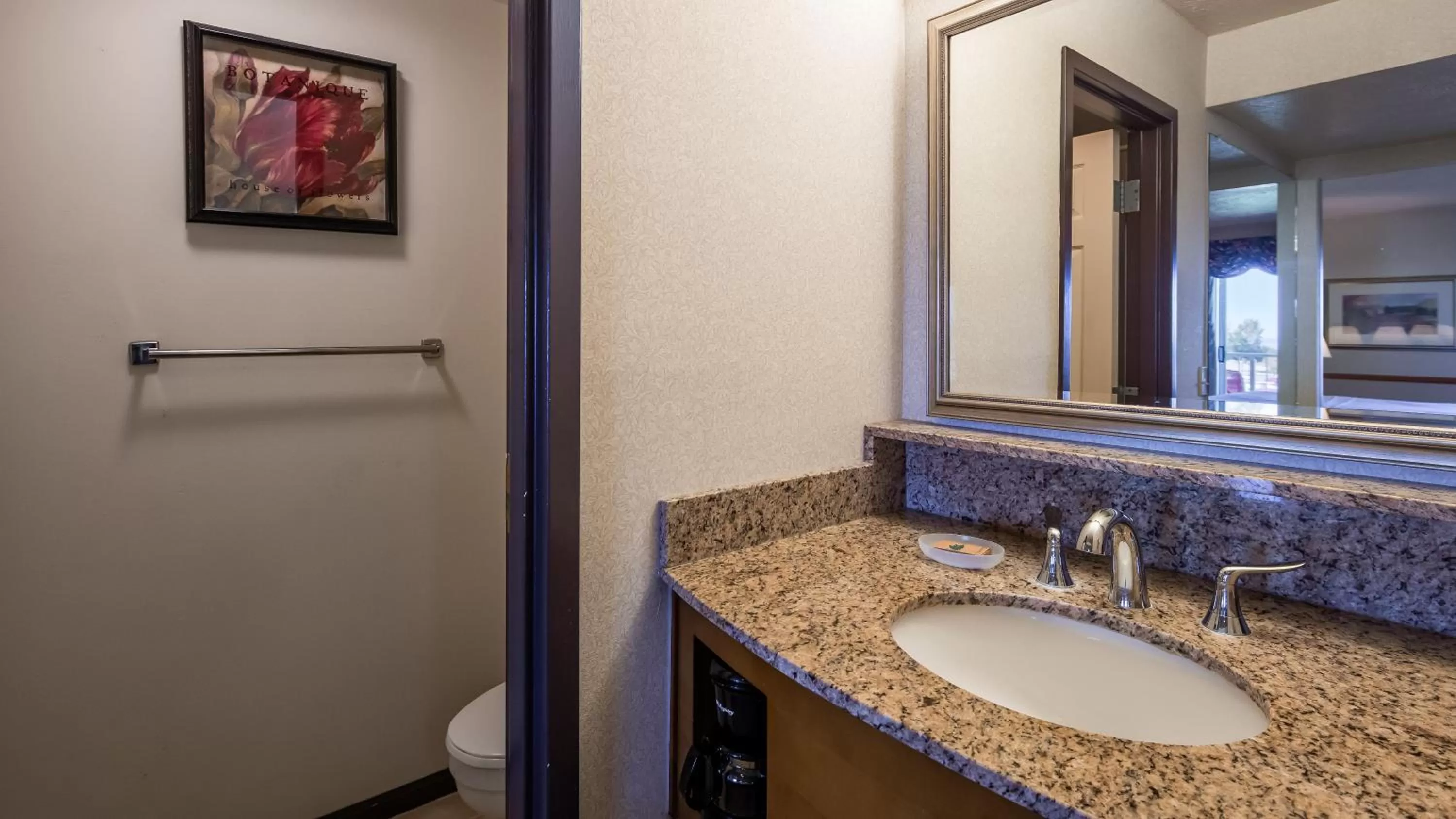 Bathroom in Apple Tree Inn; SureStay Collection by Best Western