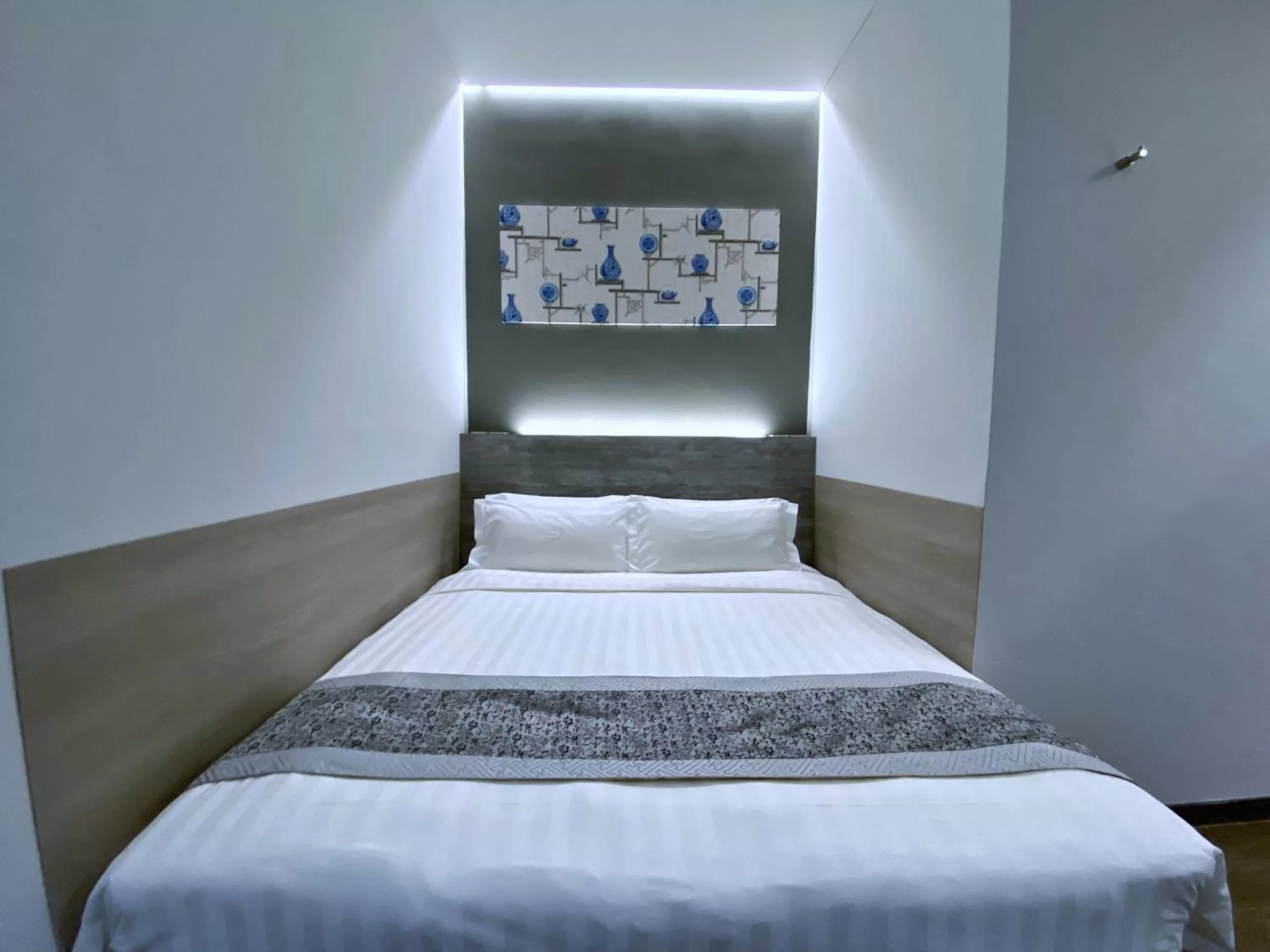 Bed in Bliss Hotel Singapore