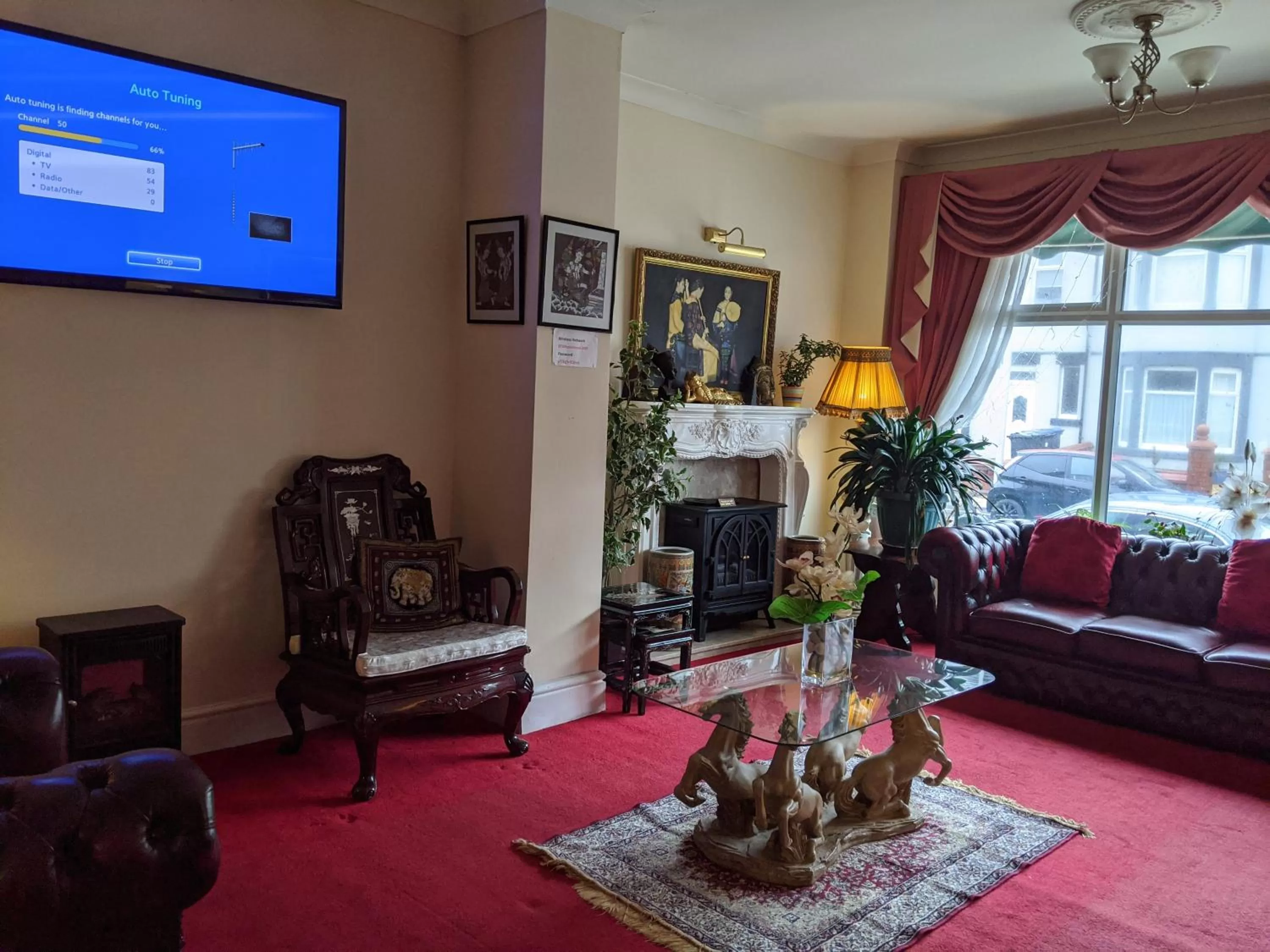Communal lounge/ TV room in The New Guilderoy Hotel