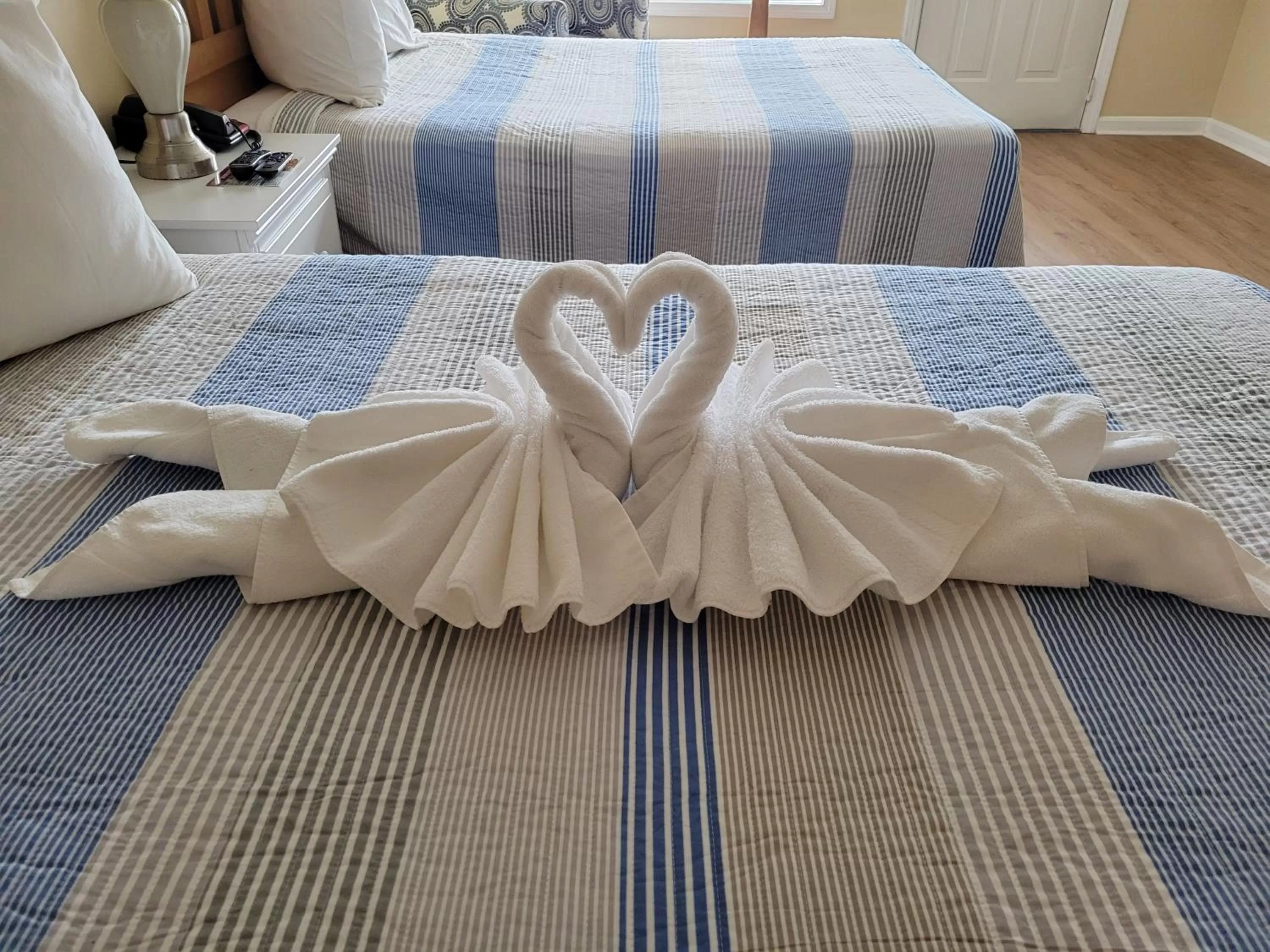 Bed in The Grand Beach Inn