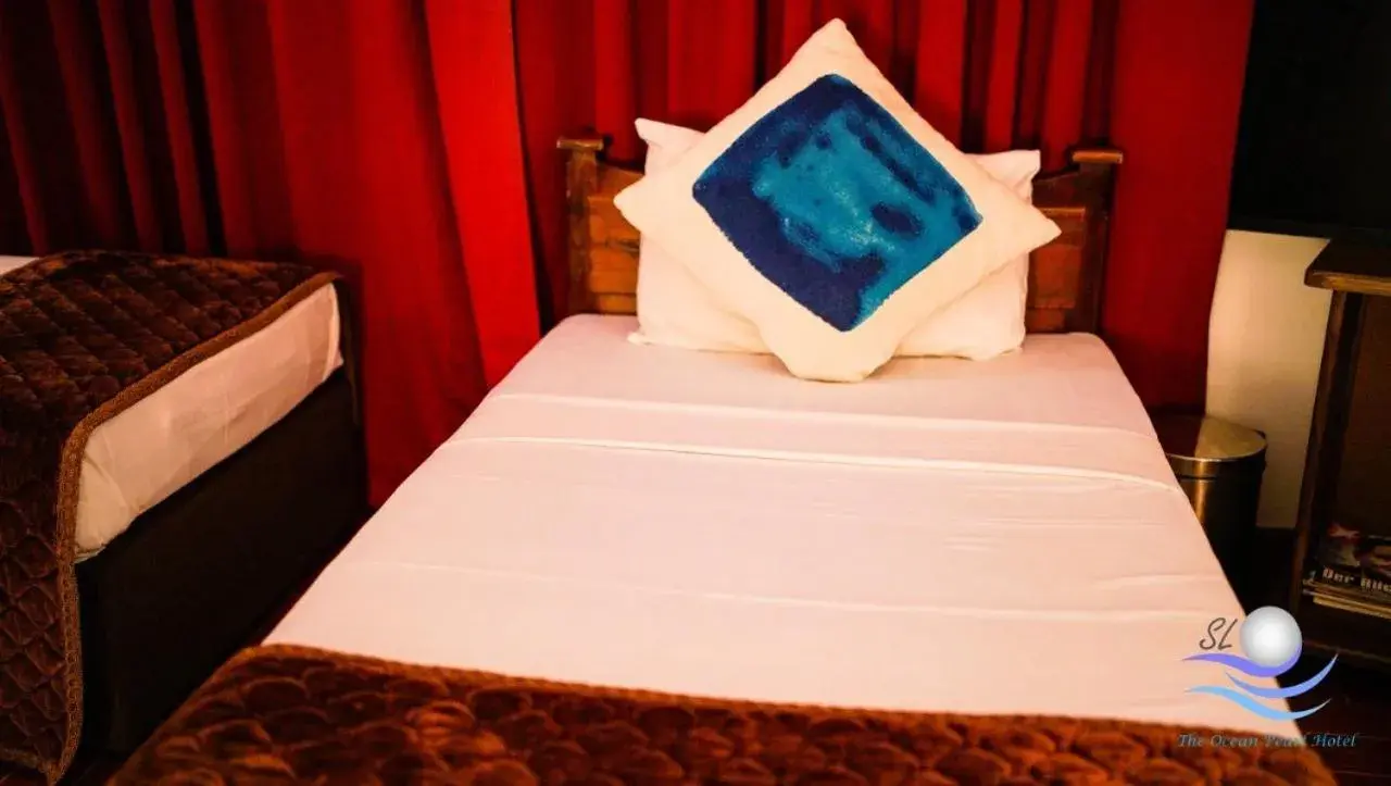 Bed in The Ocean Pearl Hotel Negombo