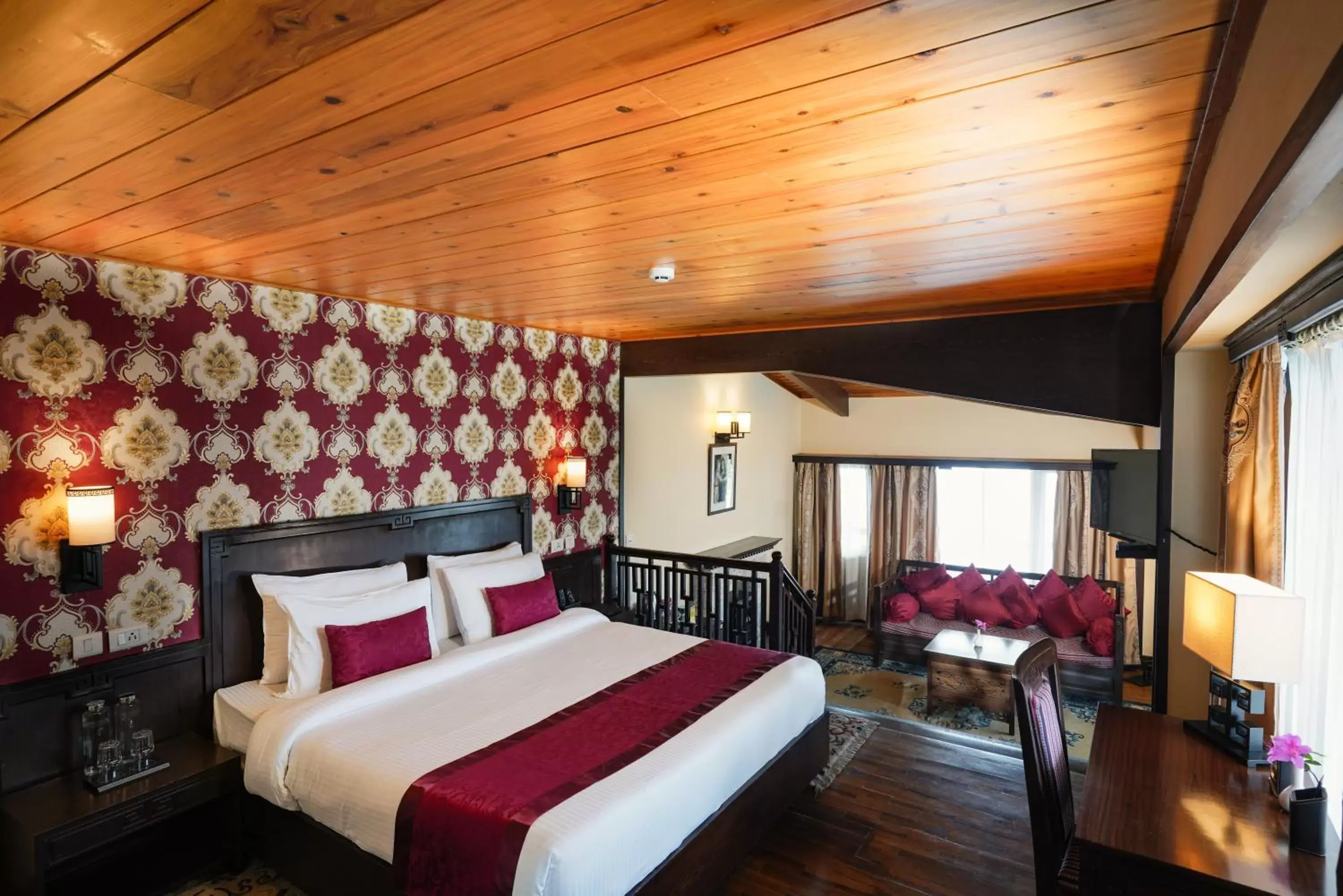 Living room, Bed in Denzong Regency- Luxury Mountain Retreat Spa & Casino