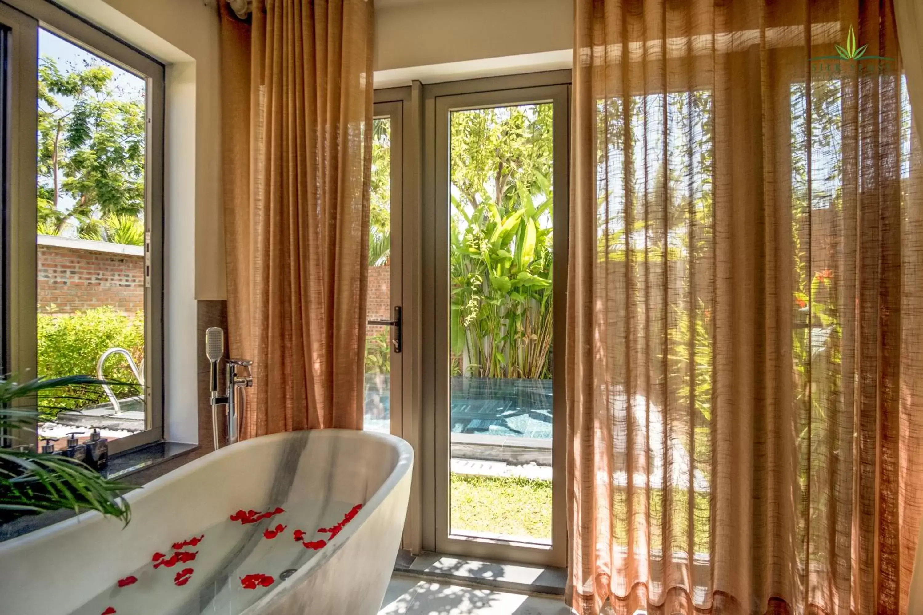 Bathroom, View in Silk Sense Hoi An River Resort