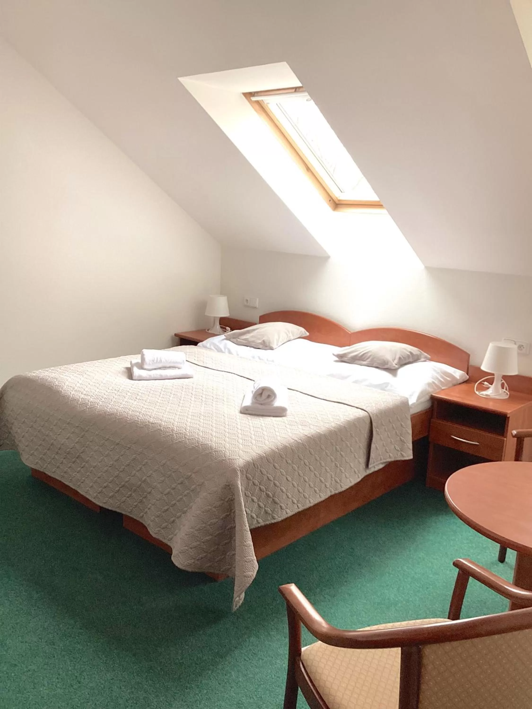 Bed in Hotel Karolina