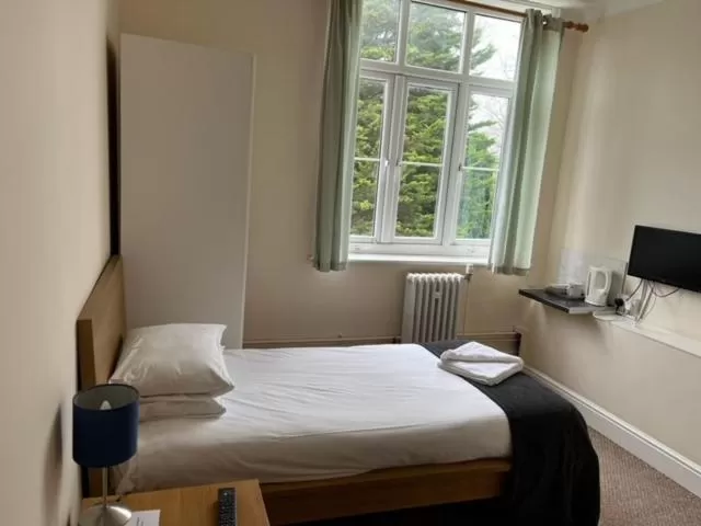 Bed in The Admiral Cunningham Hotel