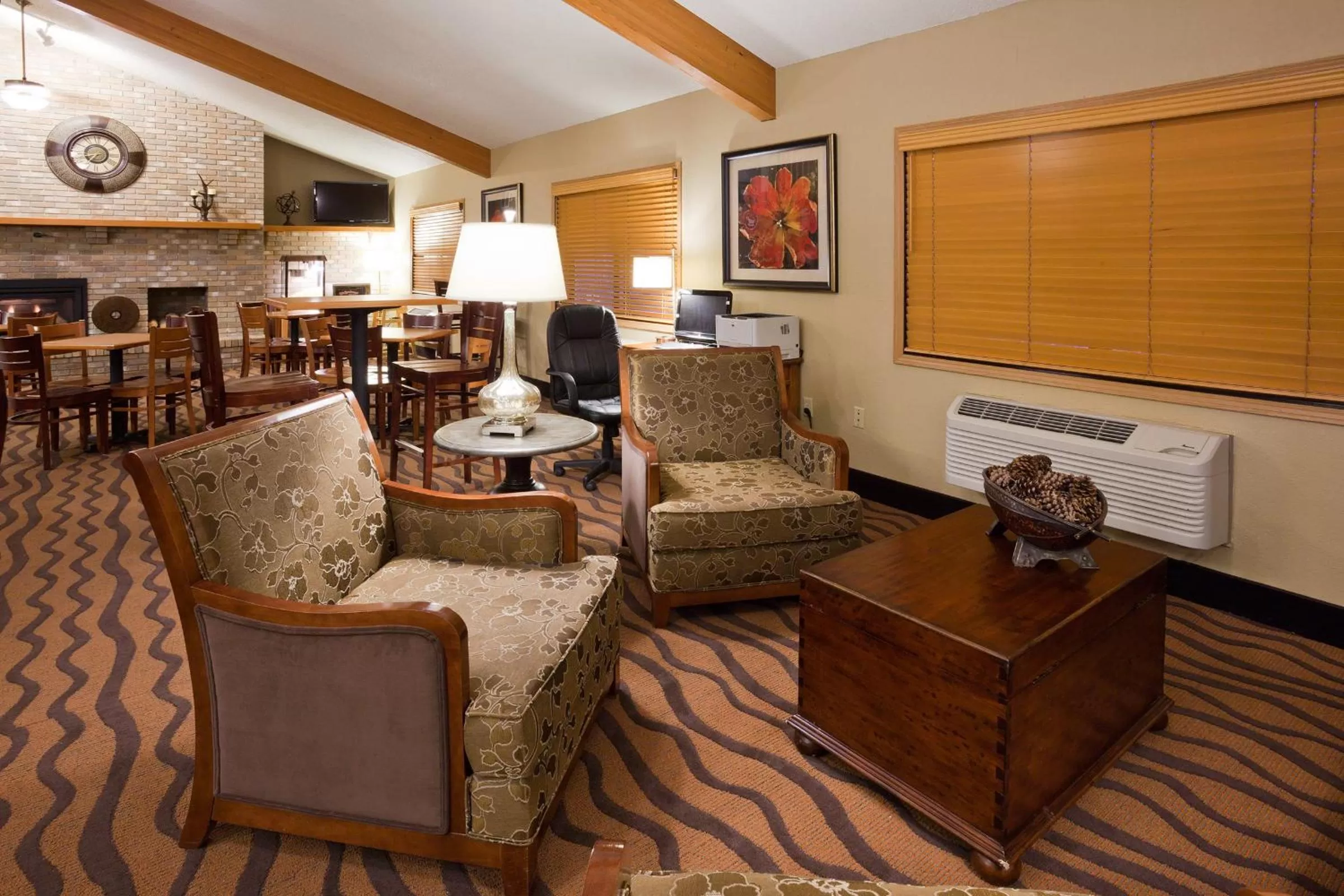 Communal lounge/ TV room in AmericInn by Wyndham Albert Lea
