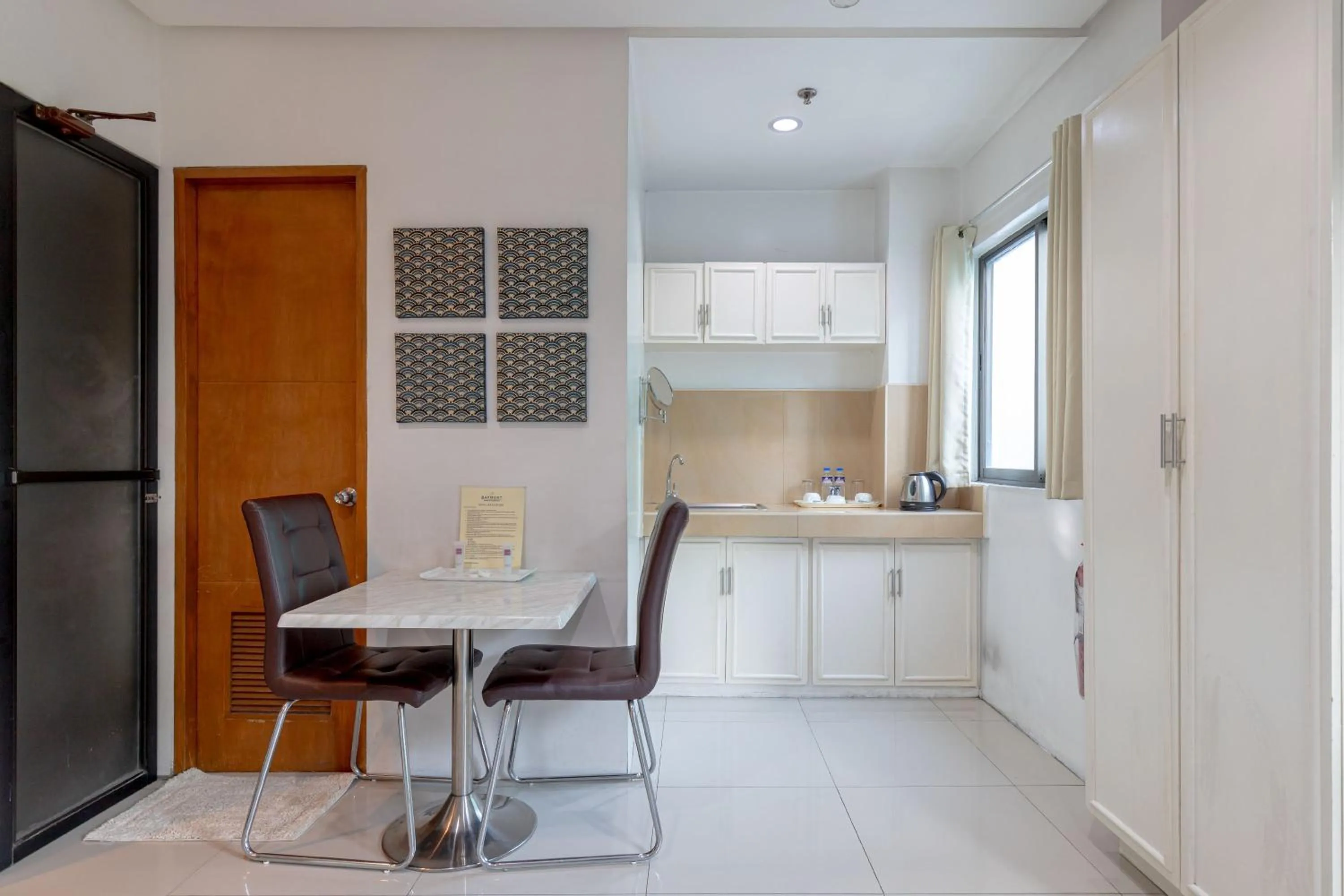 Kitchen or kitchenette in Baymont Suites & Residences